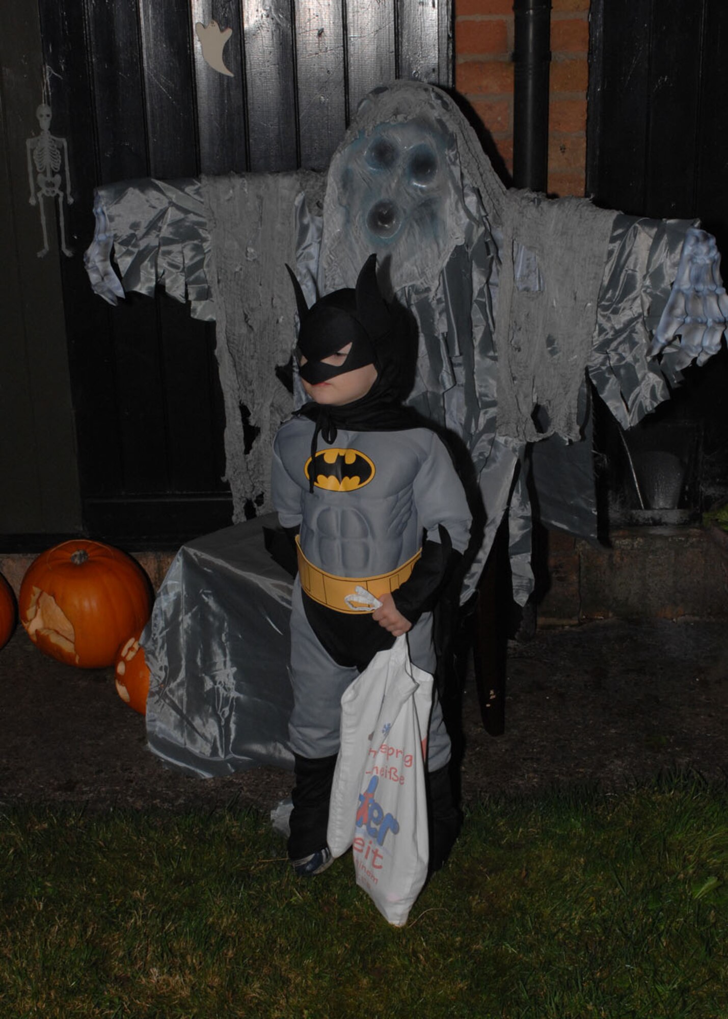 Alex Vaughn shows he is not afraid of any ghosts while trick-or-treating as “Batman” at RAF Lakenheath, England Oct. 31. (U.S. Air Force Photo by Staff Sgt. Christopher Campbell)
