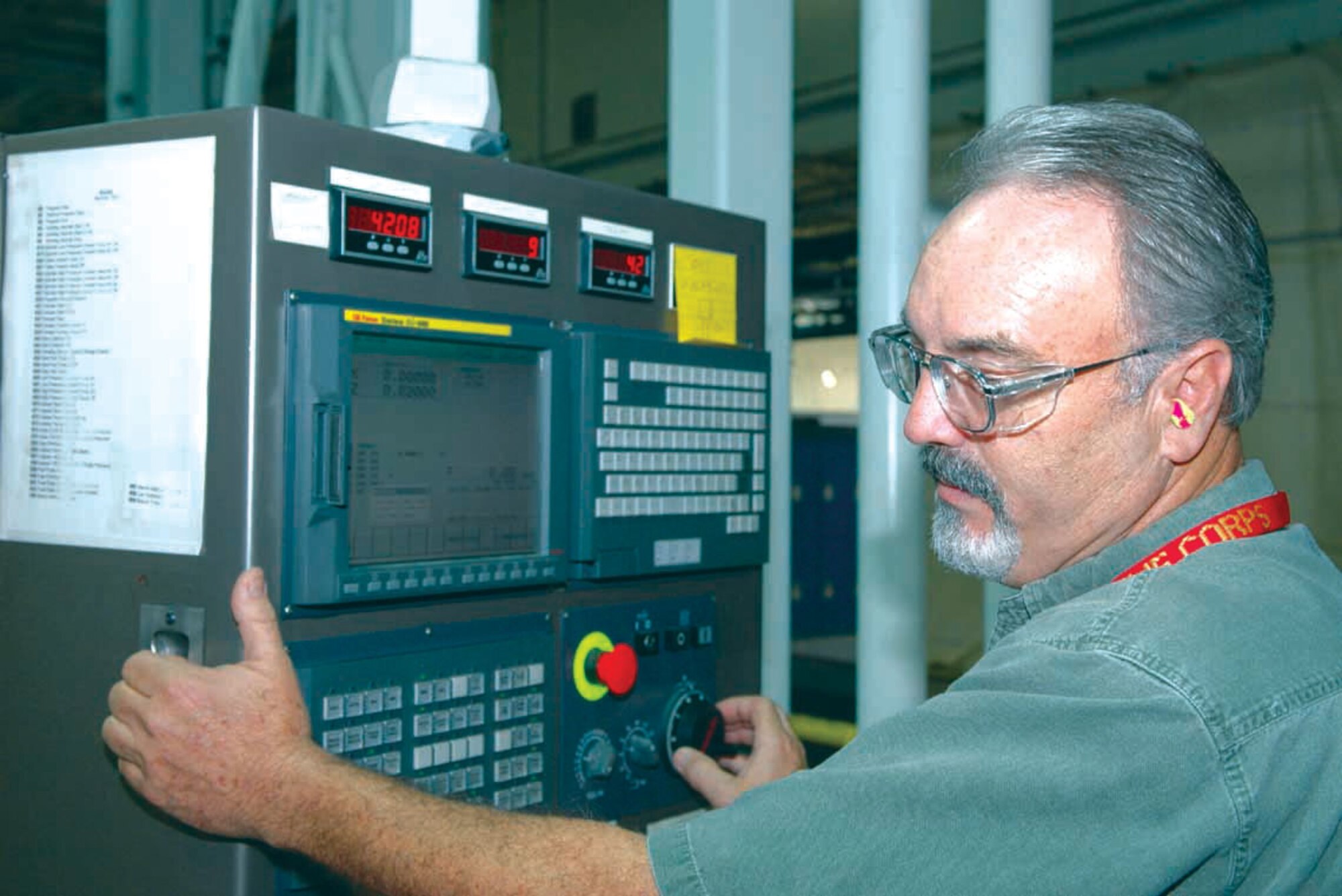 John Kelly operates the controls of a Campbell Grinder machine, while monitoring the repair of a part from an F100 engine. Mr. Kelly is a toolmaker with the 547th Propulsion Maintenance Squadron. (U.S. Air Force photo/Ron Mullan) 