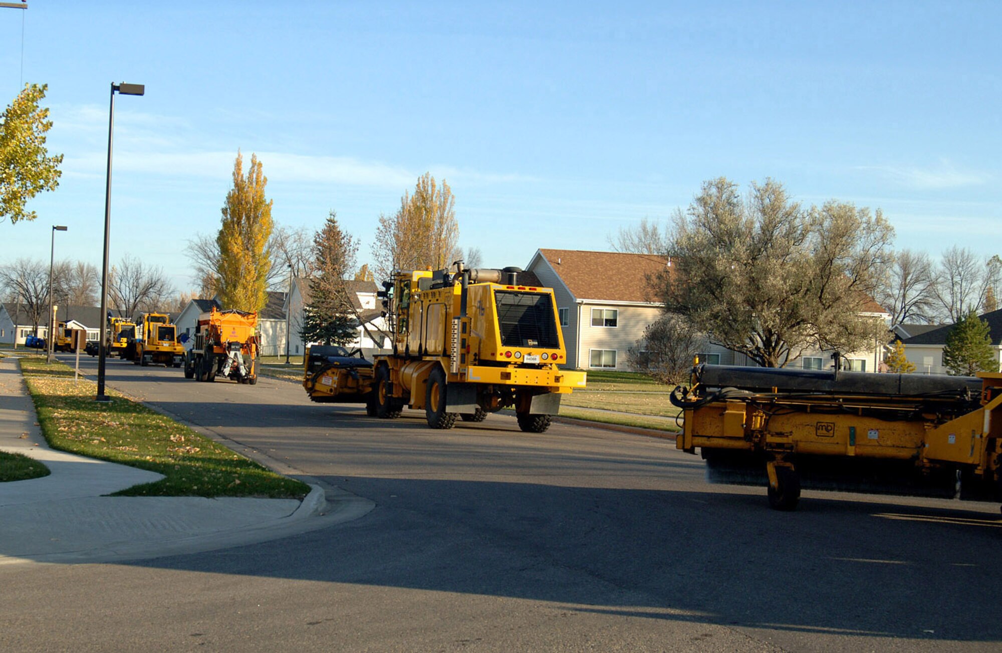 Contractors loaded with their snow removal artillery convoy along the streets of the base in honor of the annual Snow Parade at Grand Forks Air Force Base, N.D. Oct. 29. The Snow Parade is to show appreciation for the contractors and other employees involved with the snow removal process during the harsh winters experienced here. (U.S. Air Force photo/Senior Airman SerMae Lampkin)