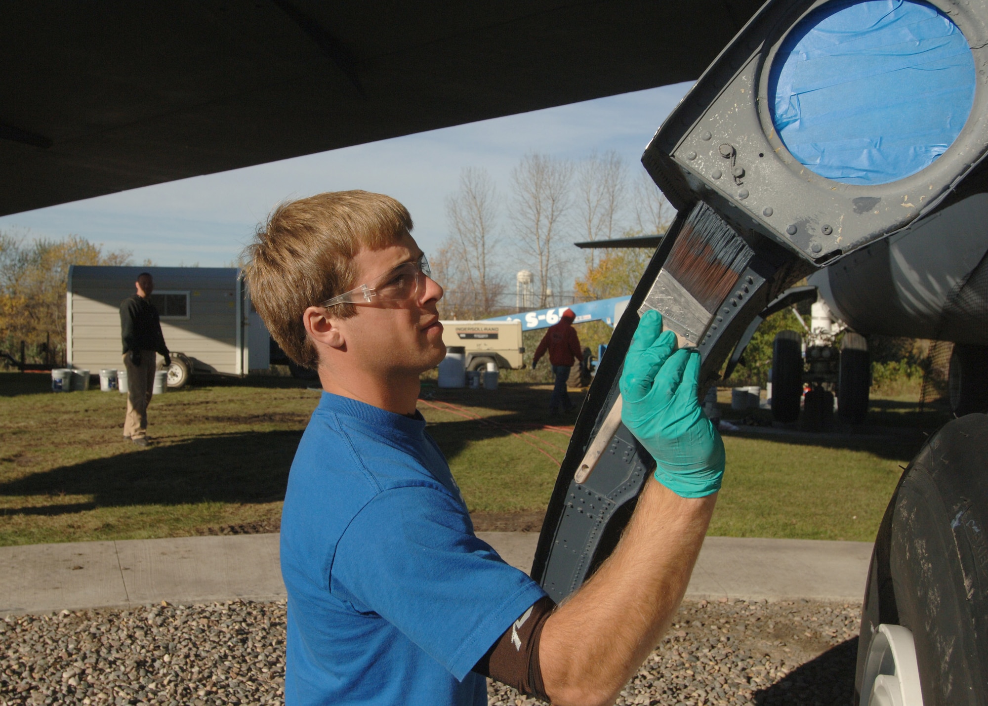 Brandon Jasper begins painting a panel of a B-52 Stratofortress static display on Grand Forks, North Dakota on October 24,  2007. The B-52 was repainted to provide a barrier between the extreme elements of the North and the body of the beloved airframe.  


(U.S. Air Force photo by Senior Airman Chad M. Kellum)(Released)