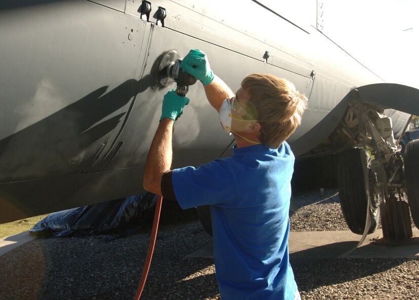 Brandon Jasper sands out rough spots on a B-52 Stratofortress static display on Grand Forks Air Force Base, N.D. on October 24,  2007. The B-52 was repainted to provide a barrier between the extreme elements of the North and the body of the beloved airframe.   


(U.S. Air Force photo by Senior Airman Chad M. Kellum)(Released)