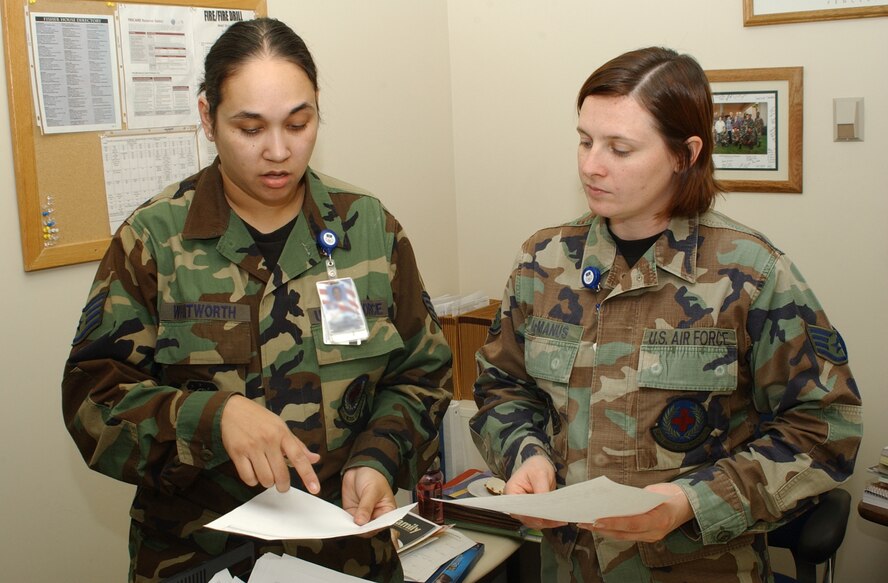 Staff Sergeant Sharon Whitworth, 341st Medical Support Squadron, or MDSS patient administrator and Staff Sergeant Christena McManus, 341st MDSS NCOIC TriCare operations and patient administration flight, discuss paperwork in Sergeant McManus’s office at the Malmstrom Clinic following an appreciation week for medical administration and records personnel called “4A Appreciation Week.” (U/S/ Air Force photo/Airman 1st Class Dillon White)                               