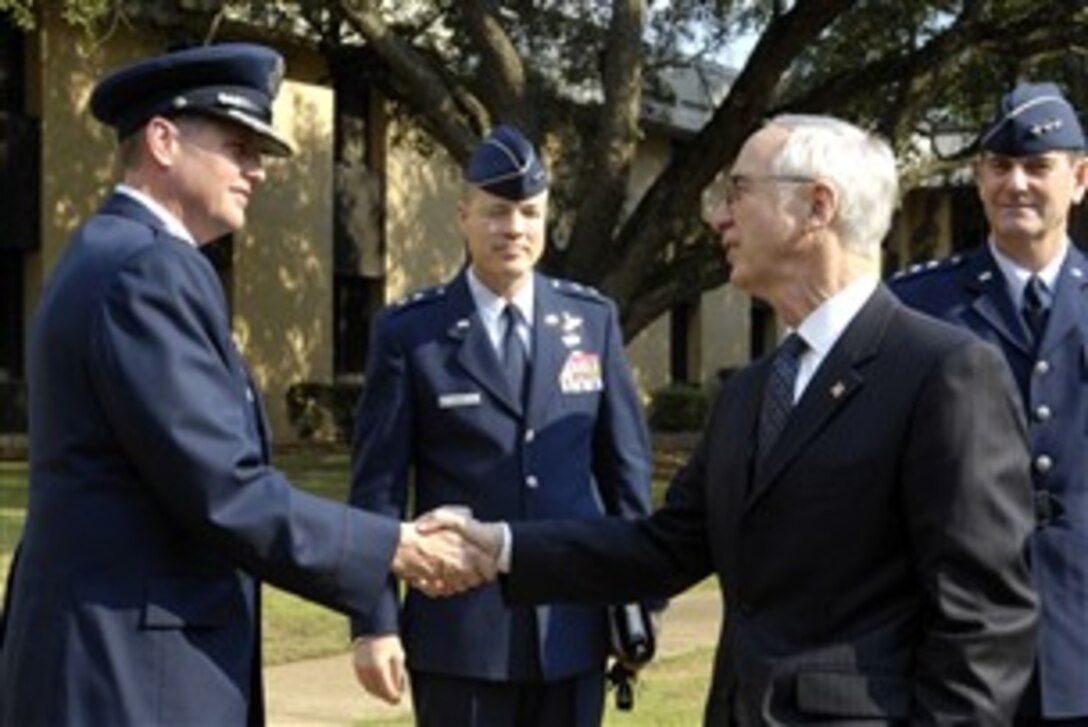 Deputy Defense Secretary Gordon R. England shakes hands with Air Force Col. Kurt Schake, dean of Academic Affairs at the Air War College after speaking to the students at Maxwell Air Force Base, Ala., Nov. 1, 2007. 