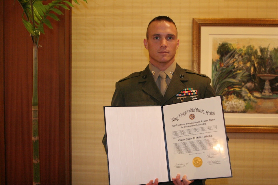 Capt. Justin Miller, a 6th Engineer Support Battalion instructor, stands with his award citation after the Navy League of the United States 105th annual national convention Sea Services Award Luncheon at the Marriott Resort in Palm Desert, Calif., Nov. 2.