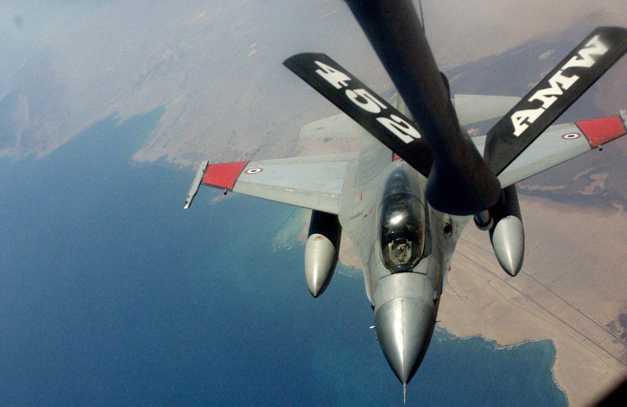 An F-16 from the Egyptian Air Force prepares to make contact with a KC-135 from the 336th ARS during in-flight refueling training. The training began in Egypt on Nov 20 and the troops will return to March ARB Wednesday.  (U.S. Air Force photo by Staff Sgt. Amy Abbott)
