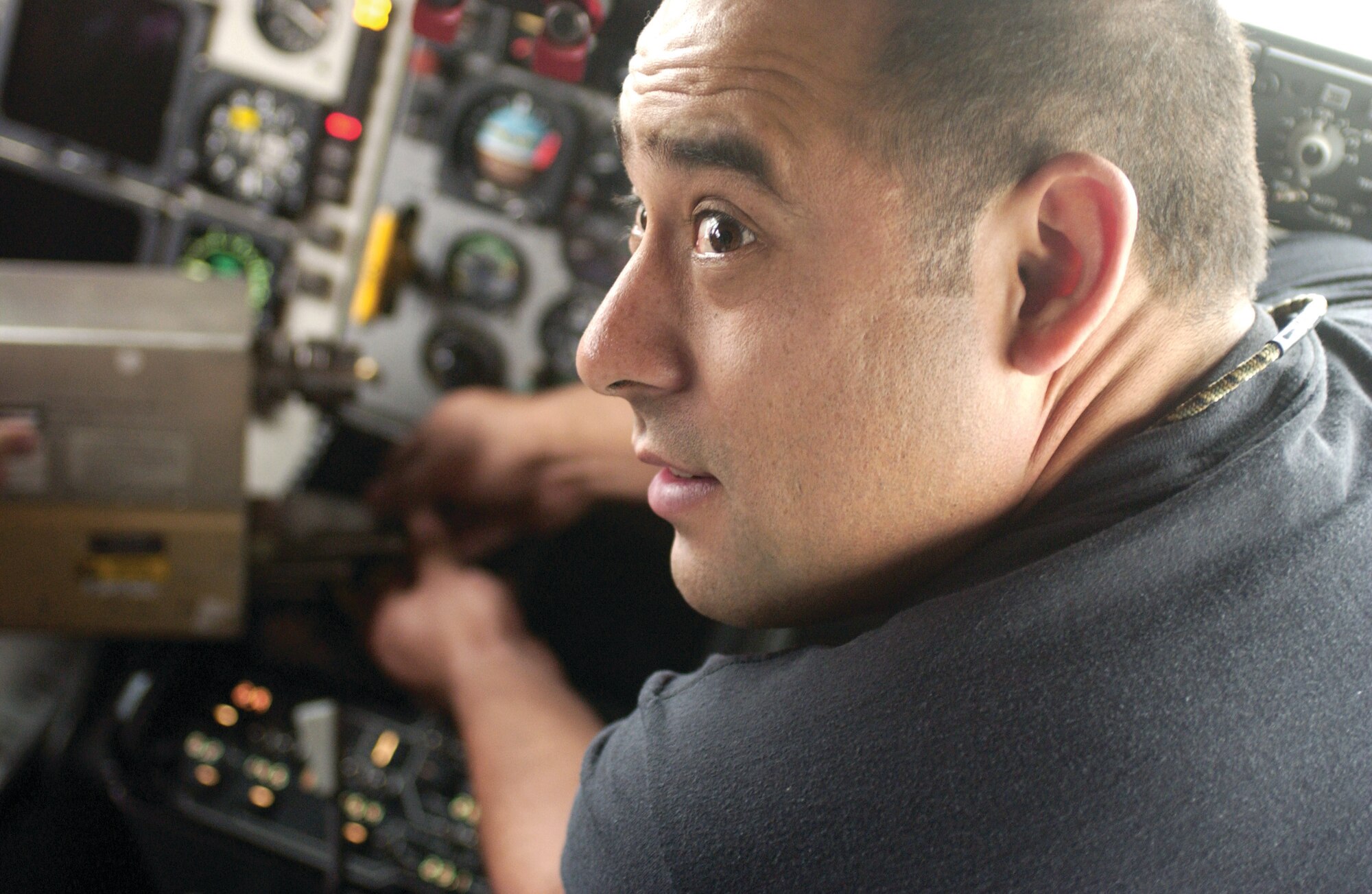 Techinal Sgt. Rudy Landa, an avionics technician with the 752nd Aircraft aintenance Squadron, swaps the pilot and co-pilot’s control display units while troubleshooting the pilot’s attitude system on a KC-135 Stratotanker.  (U.S. Air Force photo by Amy Abbott)