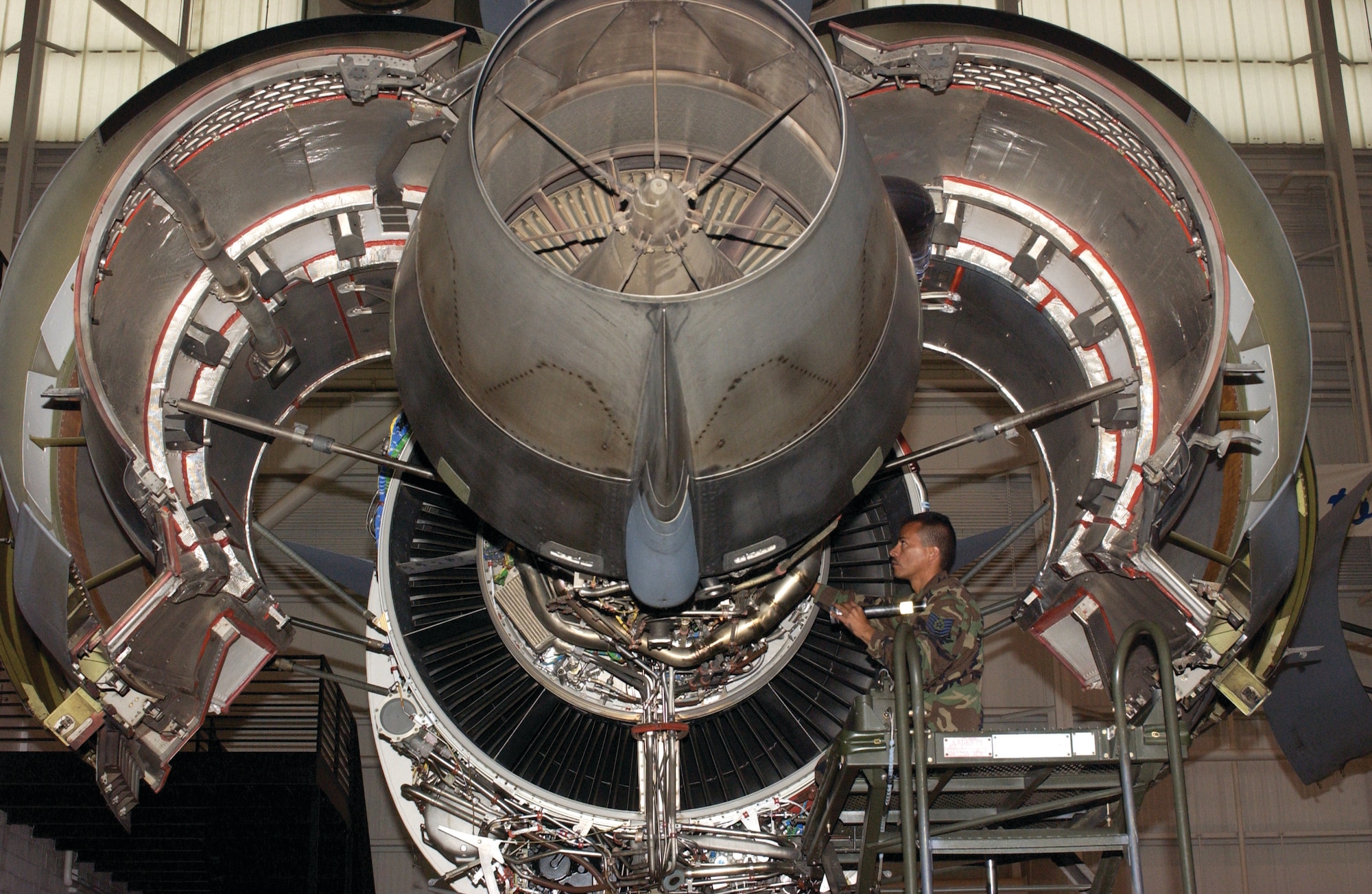 Tech Sgt. David Reyes, a jet engine mechanic with the 452nd Maintenance Squadron, inspects a C-17 Globemaster III engine, parked in the maintenance hangar, for any deficiencies.  (U.S. Air Force photo by Amy Abbott)