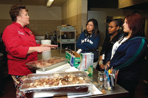 Capitol Hill High School students get the facts about life as a chef when they spent part of Oct. 25 with Tinker’s chef, Melissa Beedle. Elizabeth Gonzalez, Exzanty Moore, and Emirse Guerra, from left, were a few of the students who shadowed Tinker professionals to learn more about various careers during the Job Shadow day. (Air Force photo by Dave Faytinger)