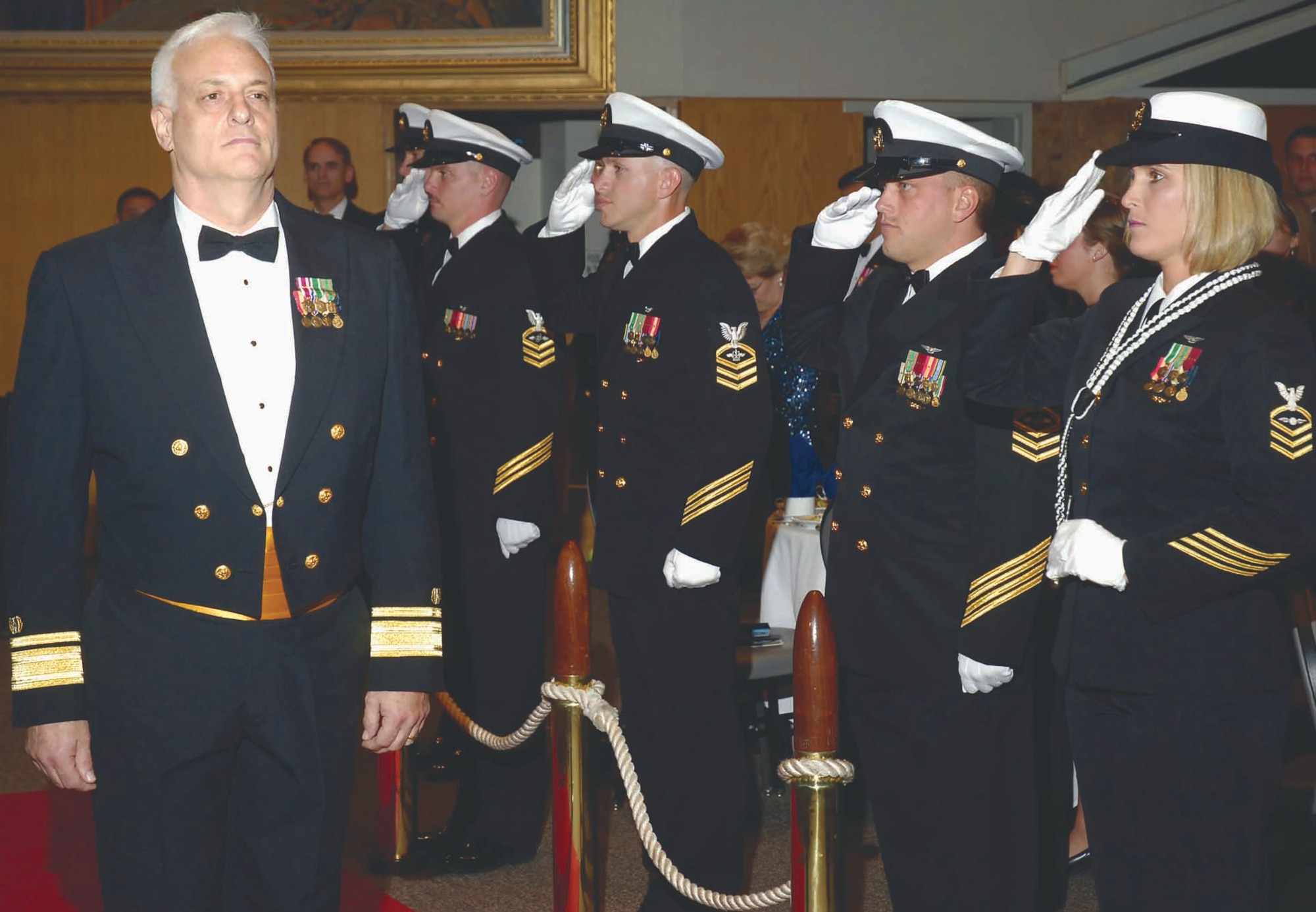 Rear Adm. Norton C. Joerg, the assistant deputy Judge Advocate General and Deputy Commander Naval Legal Service Command, is piped aboard at the beginning of the Ball. Admiral Joerg was on hand to present the LN1 Kimberly Clark award. (Air Force photo by Dave Faytinger)