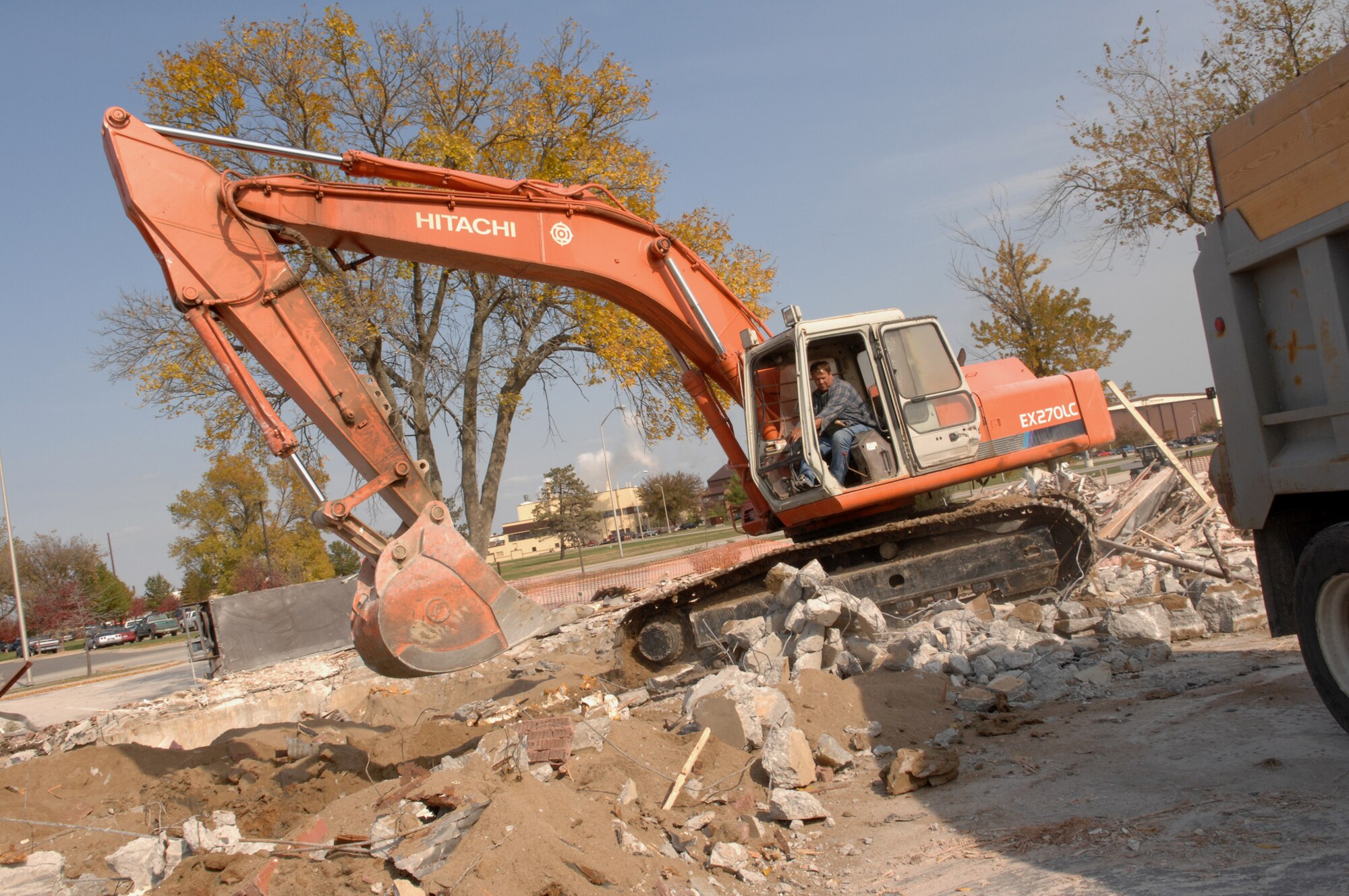 WHITEMAN AIR FORCE BASE, Mo.—Tom Craig, owner and an operator of Craig’s Excavating, tears through debris that was previously the Whiteman First Term Airman’s Center. The FTAC is now located in the Whiteman Professional Development Center on Spirit Boulevard. (U.S. Air Force photo/Airman 1st Class Stephanie Clark) 