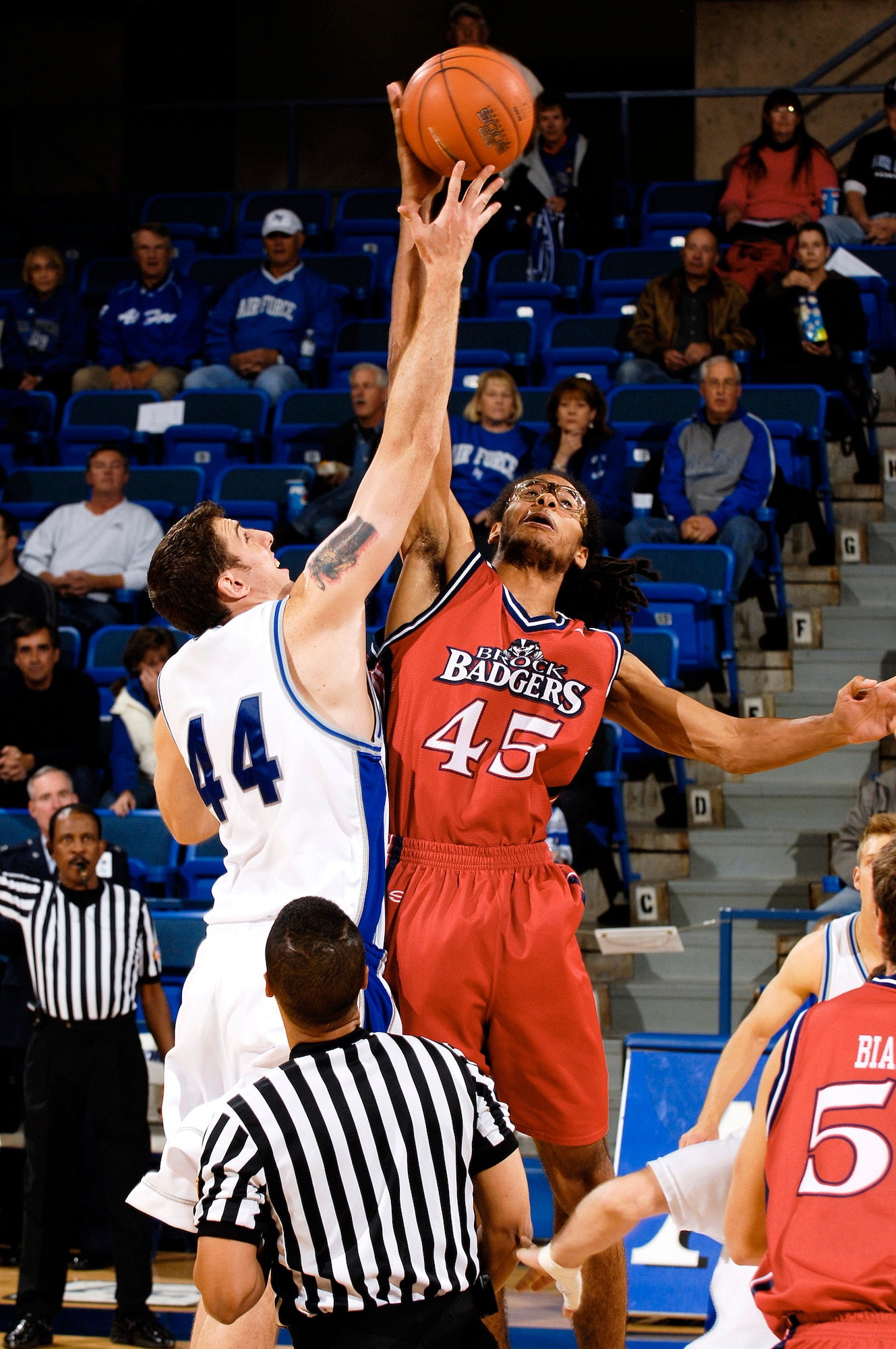 Senior Keith Maren tips off to start the Brock University exhibition basketball game at the academy's Clune Arena. Maren pulled down a game-high 11 rebounds as Air Force was defeated 66-63. The Falcons open the 2007-08 regular season on Nov. 9 in the Air Force Classic at Clune Arena. (U.S. Air Force photo/Lewis Carlyle)