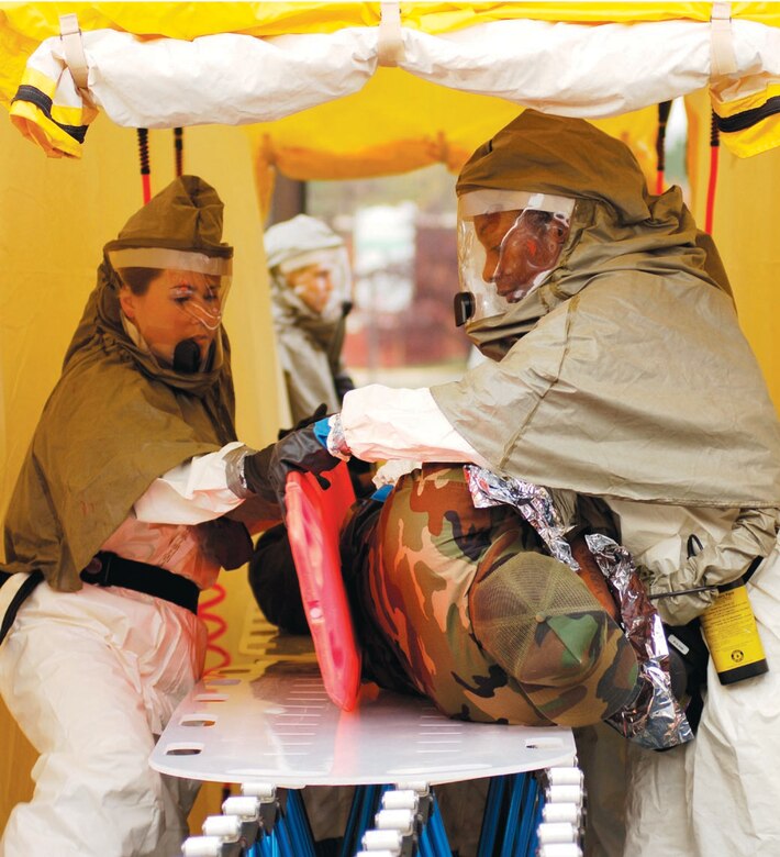 Airmen from the 79th Medical Group decontaminate patients during the mass casualty exercise during CAPITAL SHIELD 2007 on Oct. 23. (US Air Force/SSgt Suzanne Day)