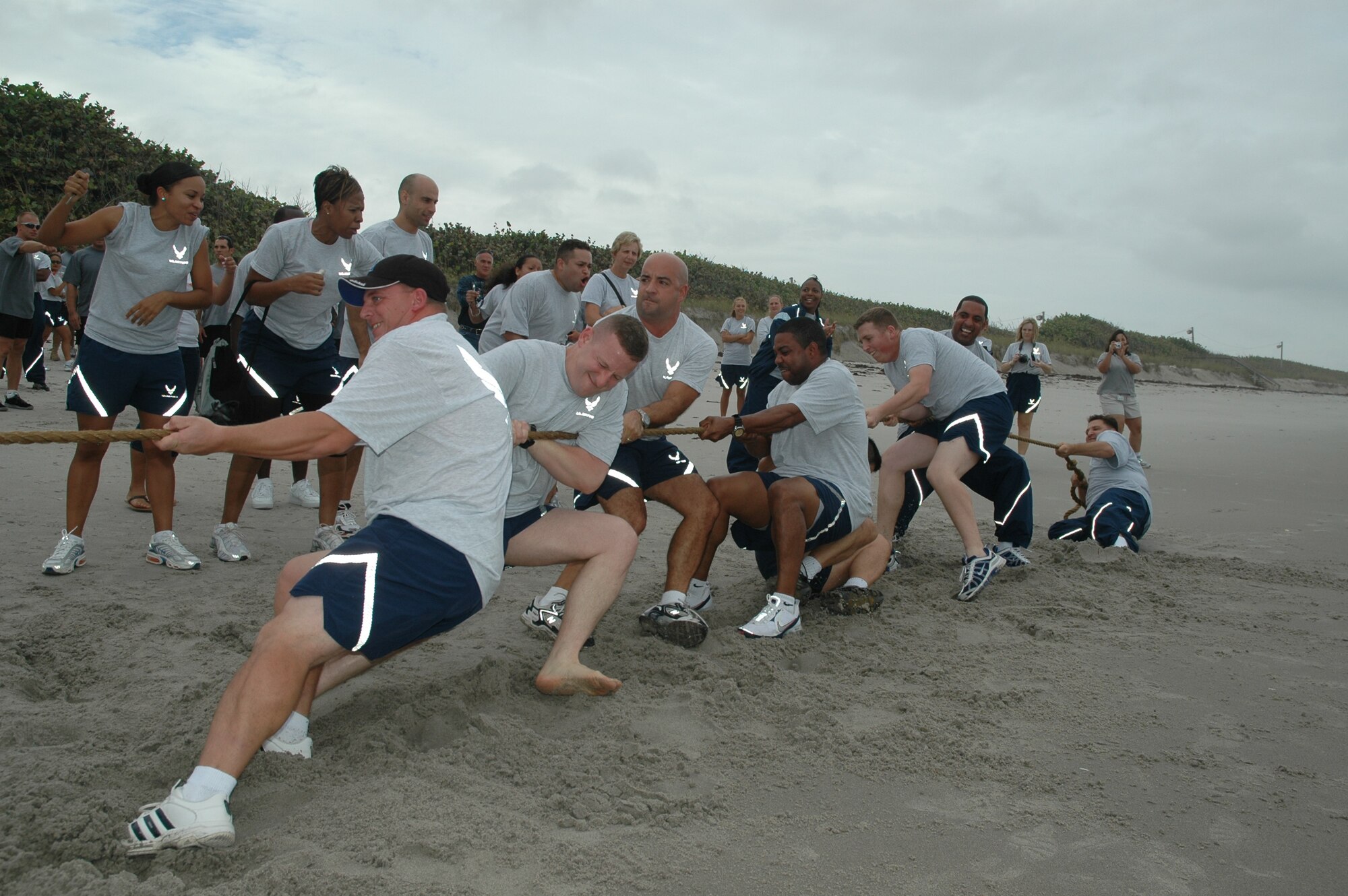 Members of the 45th Medical Group pull for all they're worth in the Olympiad's final event, the tug-of-war on the beach.