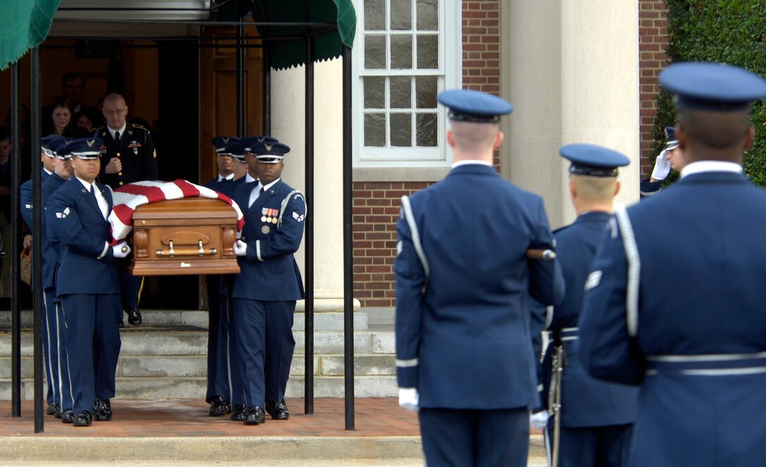 Members of the Air Force Honor Guard conduct a military honors funeral ceremony Nov. 1 for retired Lt. Gen. Marvin McNickle at Arlington National Cemetery, Washington, D.C. Honor guards across the Air Force will change the way they perform retiree funerals due to manpower cuts starting Nov. 1.  (U.S. Air Force photo/Master Sgt. Jim Varhegyi)