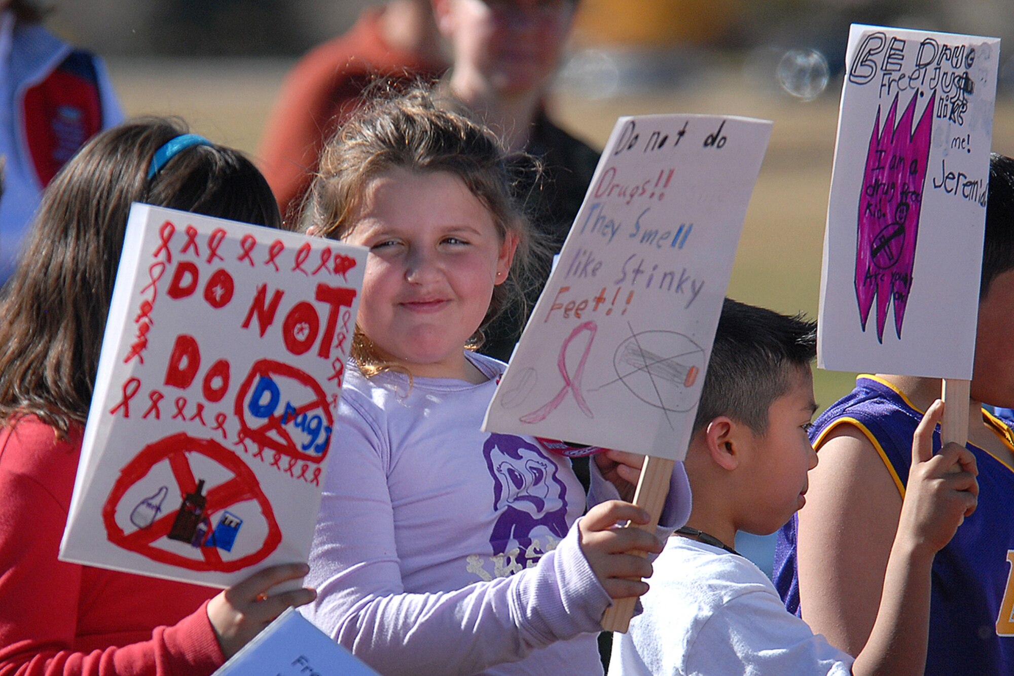 Children from Freedom Elementary School participate in the Red Ribbon Week parade Oct. 24 at Argonne Parade Field here. The children held signs with messages to don’t do drugs and marched around the field. Red Ribbon Week began to allow educators, parents, community groups and students nationwide to focus on the work being done to stop the spread of drugs and to pledge a drug-free life (Photos by Shelley Raffl).