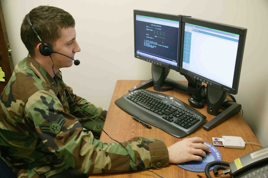 SHAW AIR FORCE BASE, S.C. -- Airman 1st Class Brandon Herr, 20th Comptroller Squadron customer service technician, helps a customer in researching a travel voucher payout Oct. 31. Shaw's finance team is being revamped throughout November and some technicians are relocating to the new Air Force Financial Service Center at Ellsworth AFB, S.D. The new center provides streamline processing and improves standardization and decreases transaction processing time. (U.S. Air Force photo/Staff Sgt. John Gordinier)