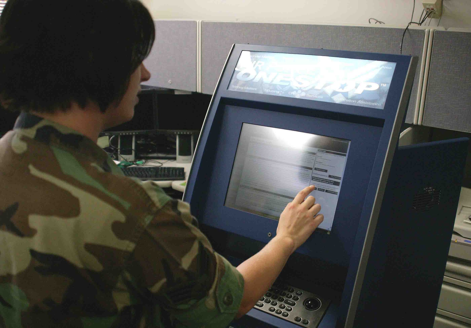 SHAW AIR FORCE BASE, S.C. -- Senior Airman Brittany Minton, 20th Comptroller Squadron finance special actions technician, shows co-workers the Air Force One Stop kiosk Oct. 31. The kiosk computer station can be placed anywhere on Shaw and can be accessed by servicemembers to check their Mypay, Thrift Saving's Plan, AF Portal and much more. Shaw's finance team is being revamped throughout November and some technicians are relocating to the new Air Force Financial Service Center at Ellsworth AFB, S.D. The new center provides streamline processing and improves standardization and decreases transaction processing time. (U.S. Air Force photo/Staff Sgt. John Gordinier)