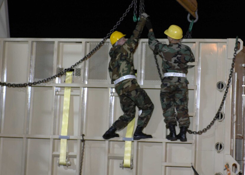 Airmen from the 60th Aerial Port Squadron work to load a crate holding Maggie the elephant’s crate on to the truck that will take her to her new home near San Andreas Calif. Maggie was transported from the Alaska Zoo via a C-17 Globemaster III out of Elmendorf Air Force Base, Alaska to live in a warmer climate. (U.S. Air Force photo/Staff Sgt. Candy Knight)