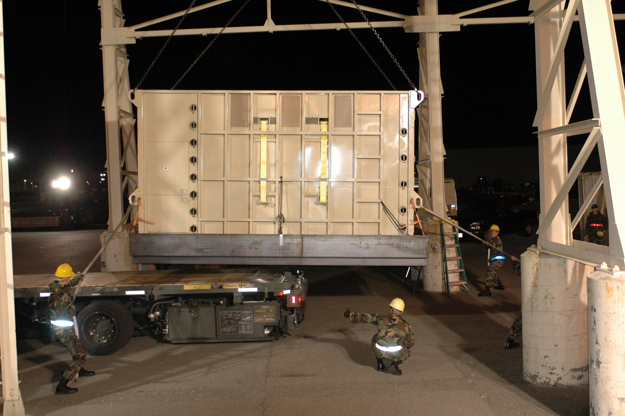 Members of the 60th Aerial Port Squadron prepare to load Maggie onto the truck that will transport her to her new home near San Andreas, Calif. Maggie was moved to California for the warmer climate. (U.S. Air Force photo/Staff Sgt. Candy Knight)
