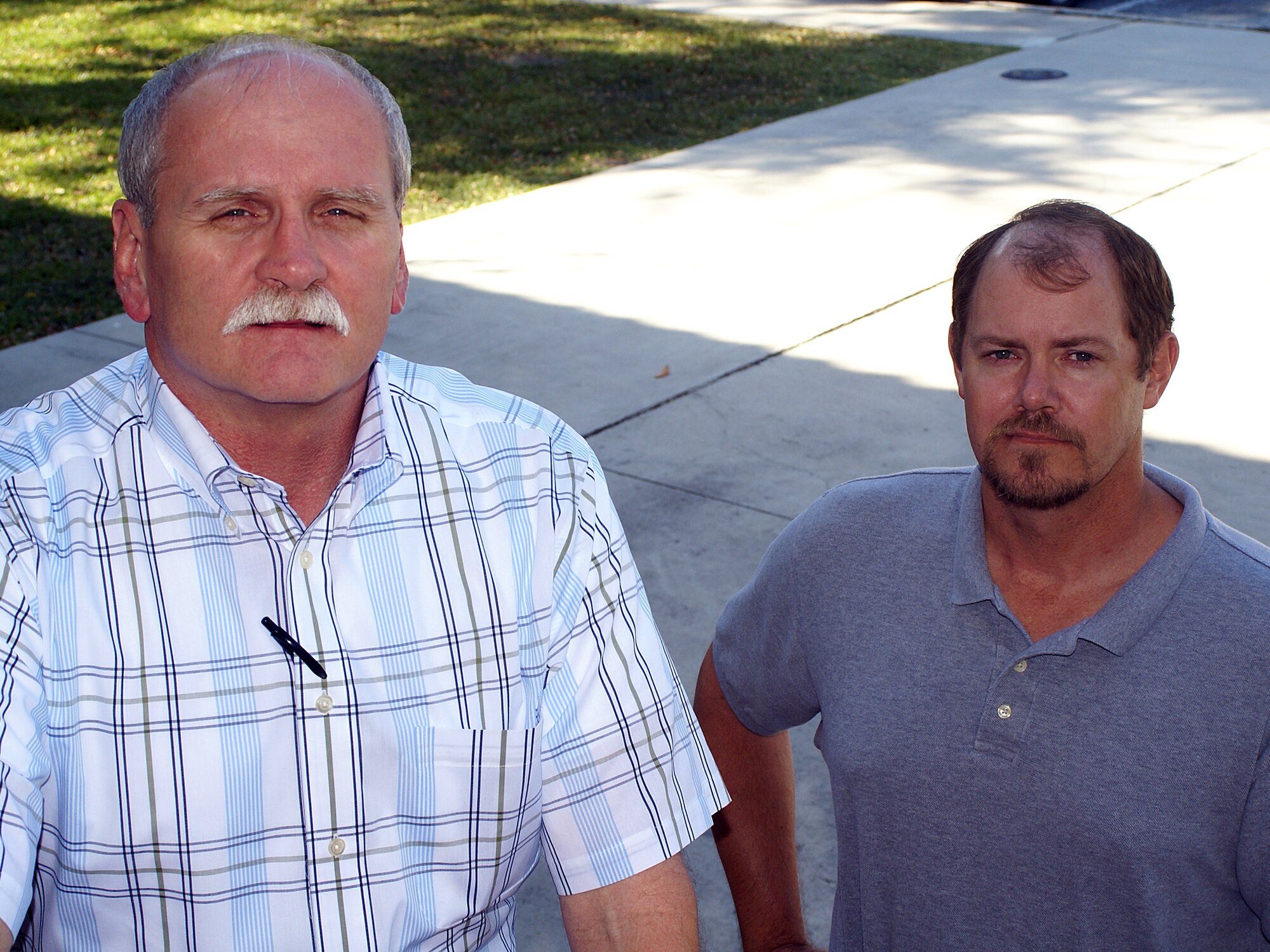 Contracted AirForce.com online advisers, Max Sellers (left)  and Craig Black, acted quickly to help a distraught Airman from potentially harming herself, and directed the right resources to get her help. Both advisers are retired Air Force recruiters with 23 years of active-duty recruiting experience between them. (U.S. Air Force photo/Chet DelSignore)          