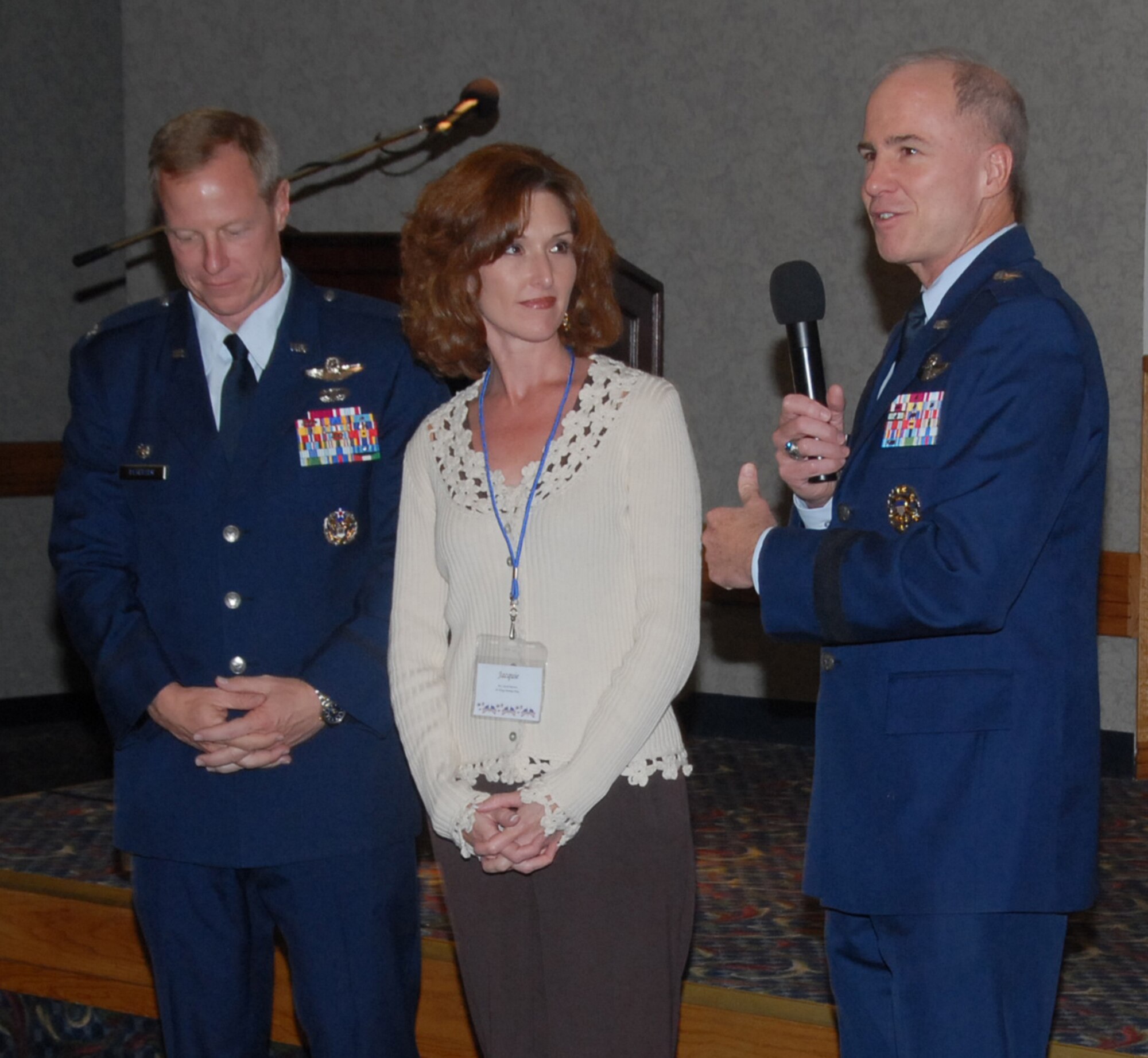 Brig. Gen. Richard Devereaux, commander of the 82nd Training Wing, introduces new 80th Flying Training Wing Commander Col. Dave Petersen and his wife, Jacquie, Nov. 1 at a Commander's Reception in the Sheppard Club. The reception allowed Sheppard's commanders to socialize with civic leaders from communities surrounding the base. (U.S. Air Force photo/Mike Litteken)