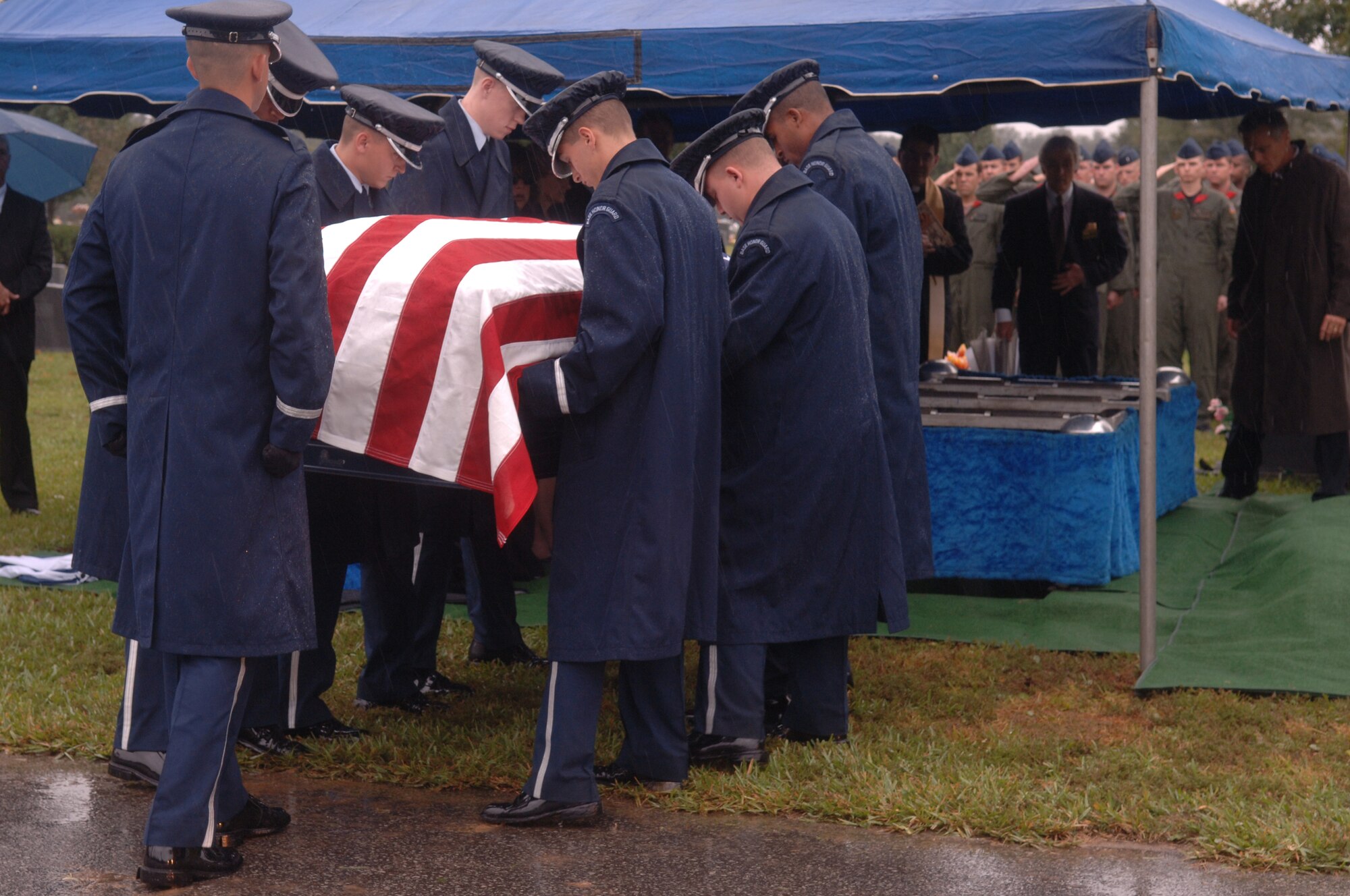 Members of the Hurlburt Field Honor Guard carry retired Col. William Tackas' casket to the graveside ceremony at Beal Memorial Cemetary in Fort Walton Beach Oct. 22. Colonel Tackas was the first commander of the 20th Special Operations Squadron. (U.S. Air Force photo by Senior Airman Ali Flisek)