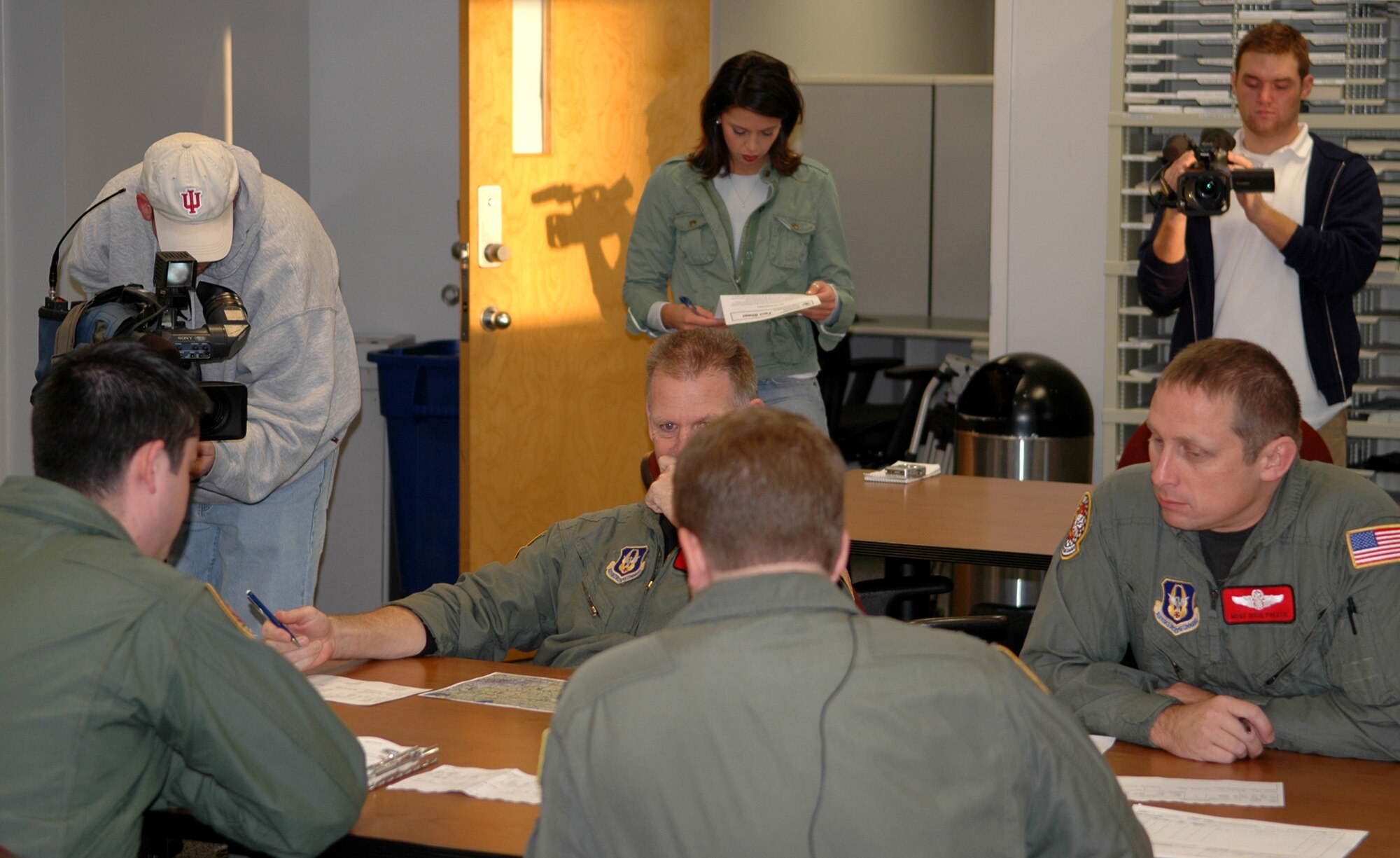 GRISSOM AIR RESERVE BASE, Ind., -- Media from WANE-TV, from Fort Wayne, Ind., visited Grissom to take part in an in-flight refueling mission. The media were able to follow the flight crew, from the 74th Air Refueling Squadron, through the whole process. Here the media is video taping the pre-flight briefing. (U.S. Air Force photo/ Senior Airman Carl Berry)