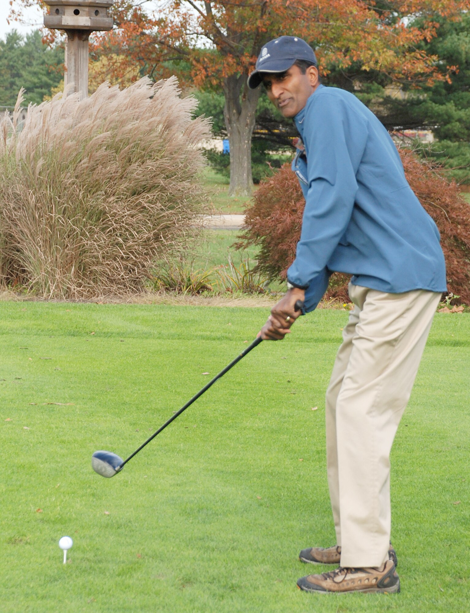 Col. Balan Ayyar, 305th Air Mobility Wing commander, prepares for a practice swing at the Combined Federal Campaign golf tournament Nov. 1 at the Falcon Creek Golf Course here. The CFC runs through Nov. 30. (U.S. Air Force photo / Airman 1st Class Rebekah Phy)