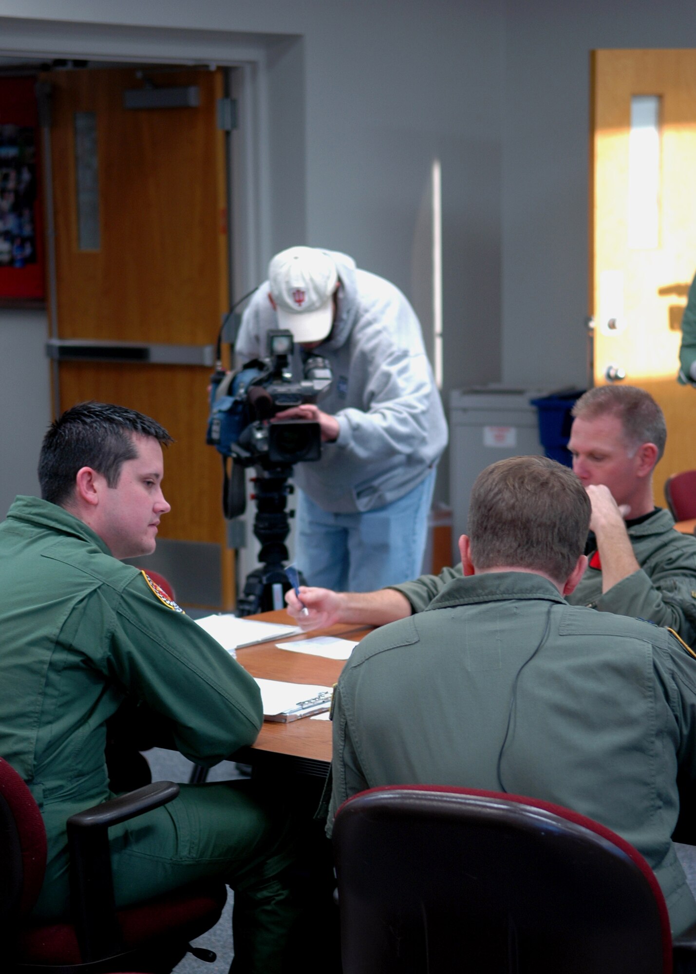 GRISSOM AIR RESERVE BASE, Ind., -- Media from WANE-TV, out of Fort Wayne, Ind., visited Grissom to take part in an in-flight refueling mission. The media were able to follow the flight crew, from the 74th Air Refueling Squadron, through the whole process. Here the media is recording the pre-flight briefing. (U.S. Air Force photo/ Senior Airman Carl Berry)