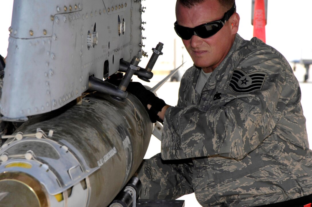 Tech. Sgt David Rey unloads a bomb from an A-10 Thunderbolt II Oct 27 at Al Asad Air Base, Iraq.  Sergeant Rey is a weapons handler deployed to Southwest Asia from the Maryland Air National Guard's 175th Wing.  (U.S. Air Force photo/Staff Sgt Angelique Perez)