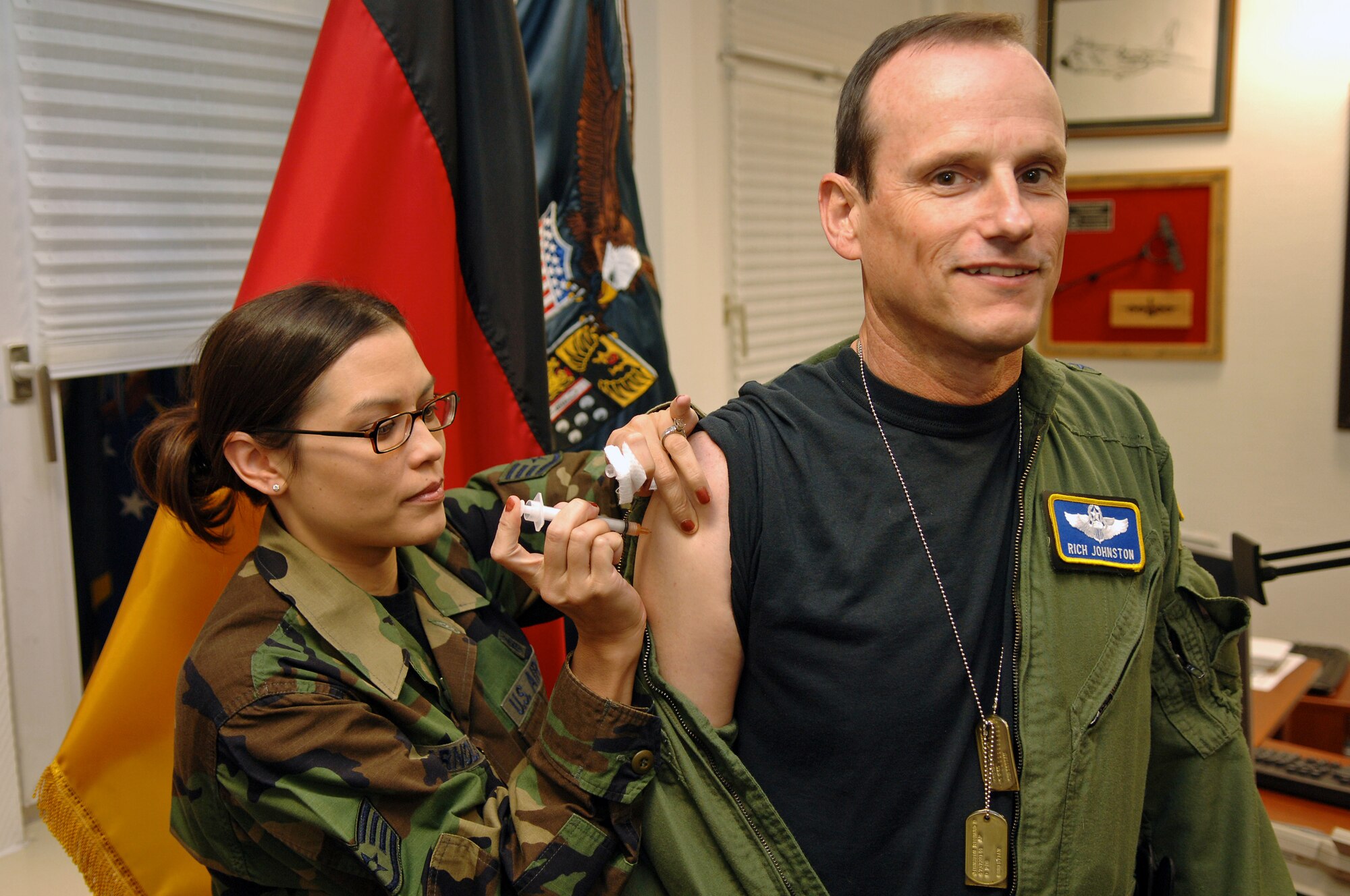 Brig. Gen. Rich Johnston, KMC and 86th Airlift Wing commander, receives the traditional flu shot. (Photo by Airman 1st Class Marc I. Lane)
