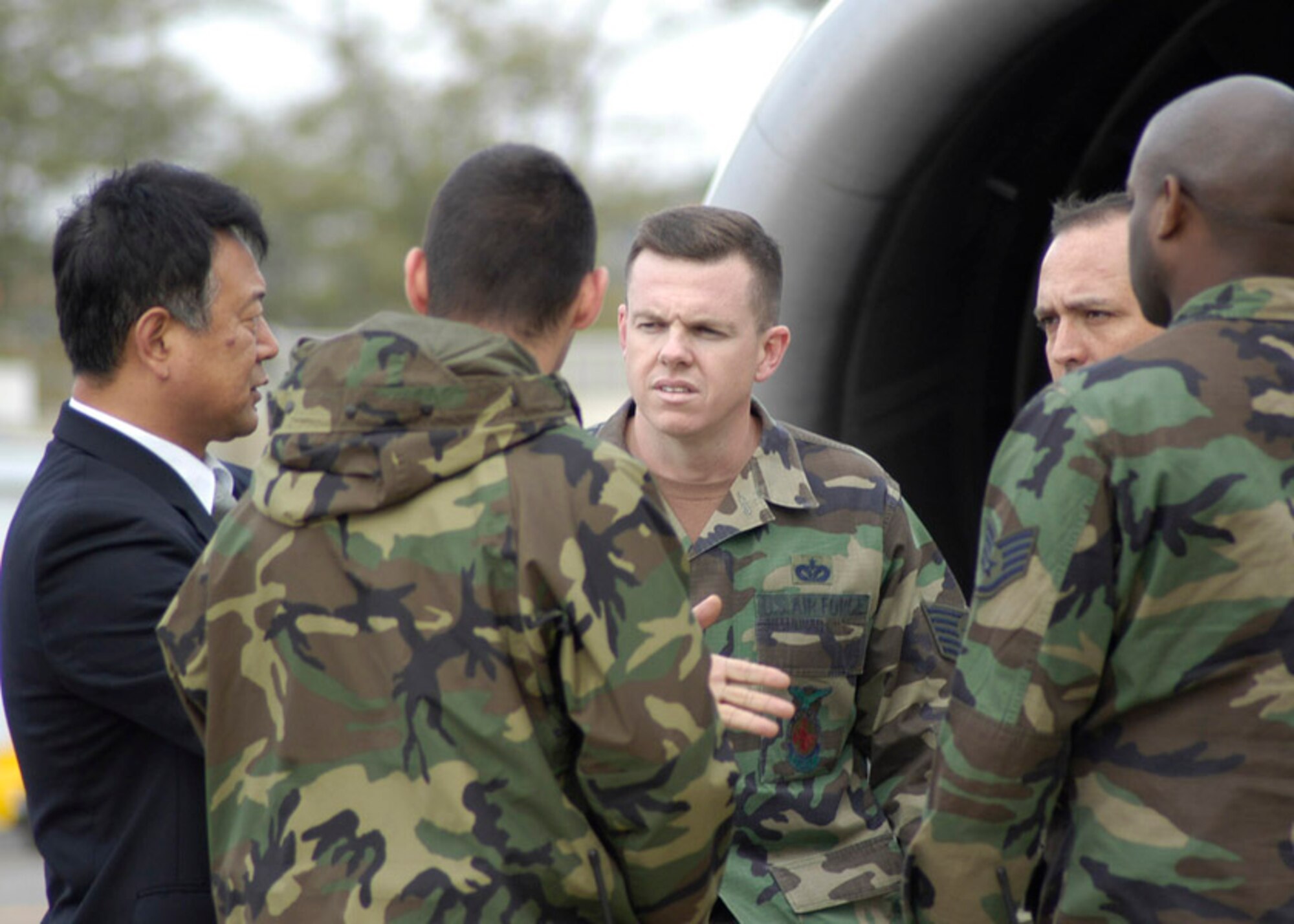 KUNSAN AIR BASE, South Korea –A Korean Airline representative briefs 8th Civil Engineering Squadron firefighters Tech. Sgt. Jason Rosenbaum, Tech. Sgt. Jefferey Shaw, Staff. Sgt. Damien Mays and Senior Airman Christopher Mann, about evacuation procedures on a Korean Airliner here Oct. 29. The fireman along with emergency medical personnel were trained at Gunsan City Airport how to evacuate people from the civilian aircraft.(U.S. Air Force photo by Staff Sergeant Araceli Alarcon)