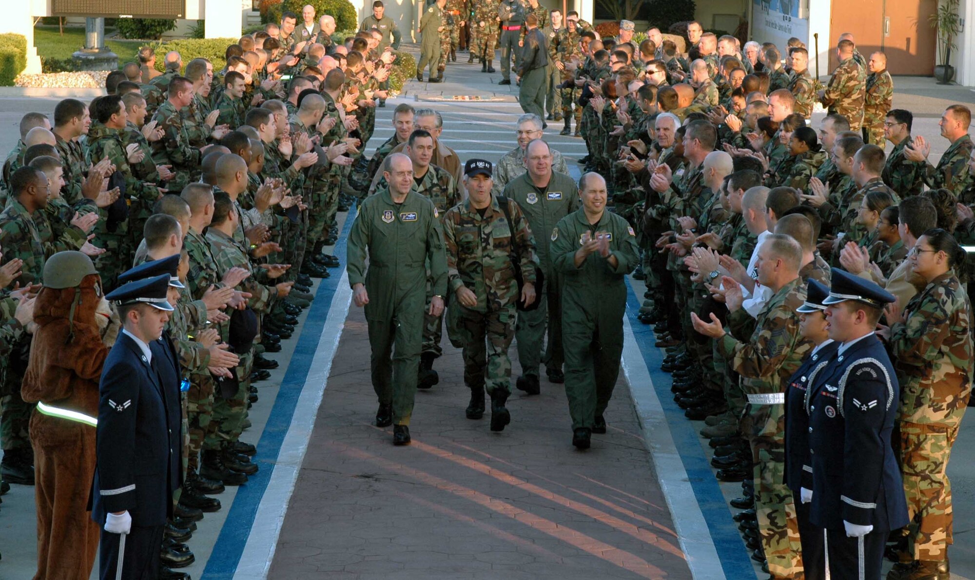 Brig. Gen. Thomas Gisler, (left), 349th Air Mobility Wing commander and Col. GI Tuck, (right), 60th Air Mobility Wing, accompany the Commander-in-Chief Installation Excellence Award inspection team as they prepare to depart Travis for Scott Air Force Base Ill., after completing the CINC IE inspection Nov. 1. Travis is competing against two other bases for a prize of $100,000. (U.S. Air Force photo/Tech. Sgt. Donald Osborn)