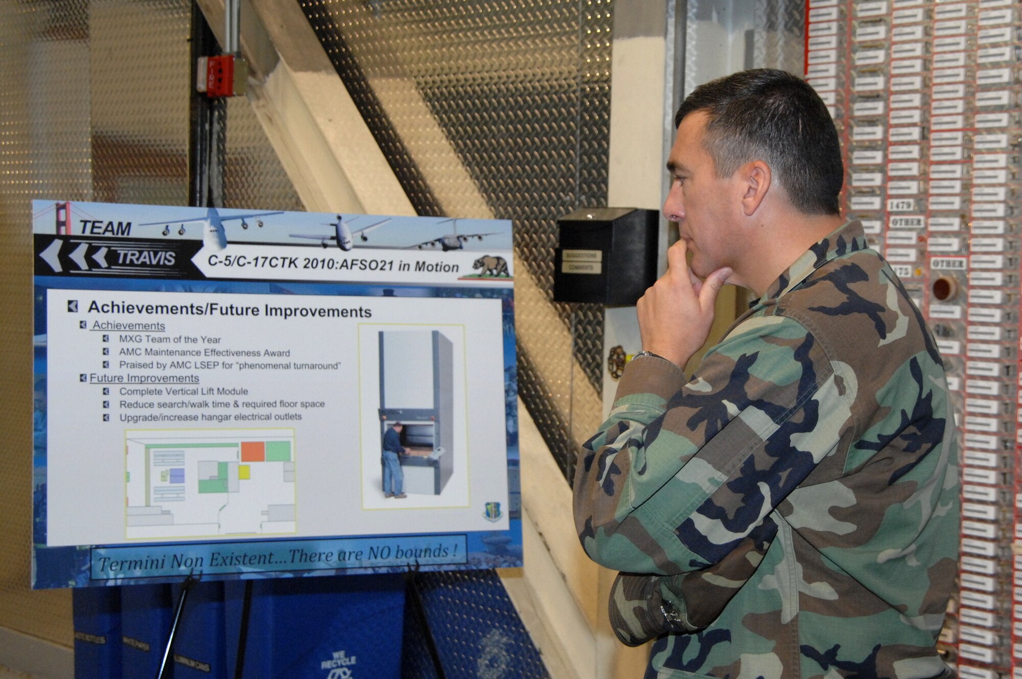 Col. Ricky Cornelio, chief, Logistics Plans Division, Directorate of Logistics, Headquarters Air Mobility Command, Scott Air Force Base, Ill., reviews the 60th Aircraft Maintenance Squadron’s C-5 and C-17 CTK storyboard. Colonel Cornelio was one of five inspectors who visited the base as part of the Commander-in-Chief Installation Excellence Award inspection team. (U.S. Air Force photo/Laura Fentress)
