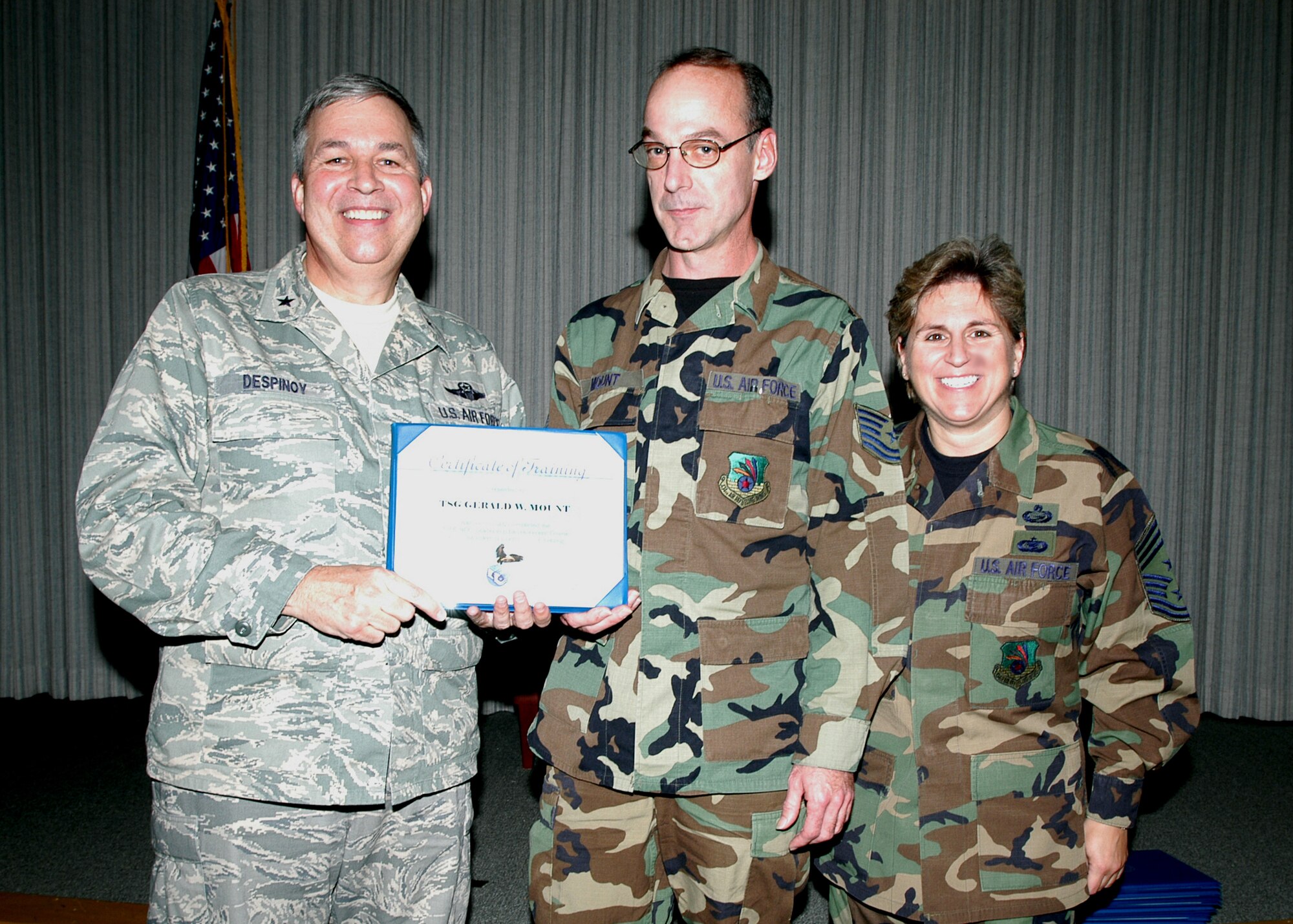GRISSOM AIR RESERVE BASE, Ind., -- Tech. Sgt. Gerald Mount, maintenance controller for the 434th Maintenance Opperation Flight receives a certificate-of-training for completing the Non-Commissioned Officer Leadership Development Course. There were a total of 15 graduates on Nov. 2. (U.S. Air Force photo/Senior Airman Carl Berry)
