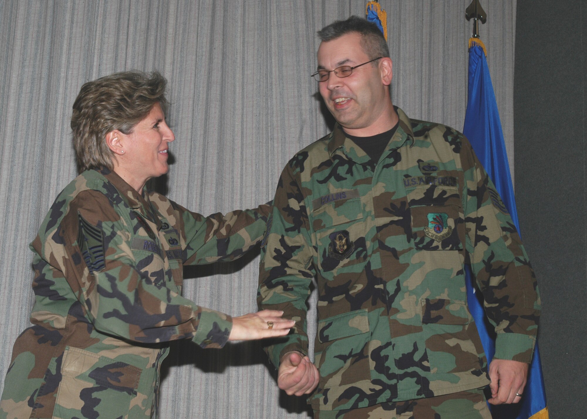 GRISSOM AIR RESERVE BASE, Ind., -- Tech. Sgt. Greg Collins, a mechanic with the 434th Maintenance Squadron, was commended for his excellent work during the Non-Commissioned Officer Leadership Development Course, by Command Chief Master Sgt. Peri Rogowsk, the command chief master sergeant for the 434th Air Refueling Wing, during the NCOLDC graduation Nov. 2. There were 15 NCO's that graduated. (U.S. Air Force photo/Senior Airman Carl Berry)