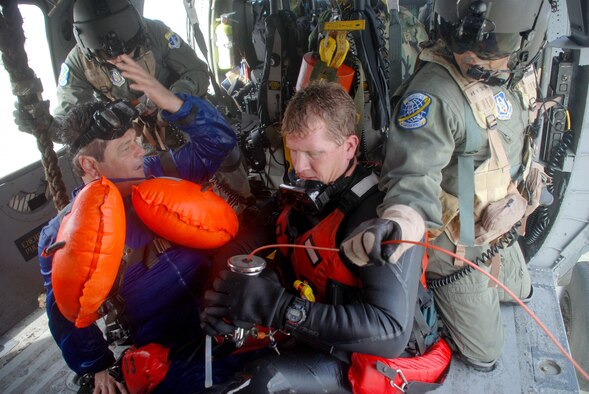 Air Force Reserve pararescuemen and aircrews from the 920th Rescue Wing kicked off NASA's World Space Expo Air Show with a search and rescue demonstration.  John Zarrella, CNN News Correspondent, acted as a downed astronaut during the demonstration which simulated a Mode 8 emergency space shuttle open-water bailout Nov 2.  Pararescuemen and crews from the 920RQW support every space shuttle launch as part of a joint task force in case an emergency occurs.  (U.S. Air Force photo/Staff Sgt. Paul Flipse)