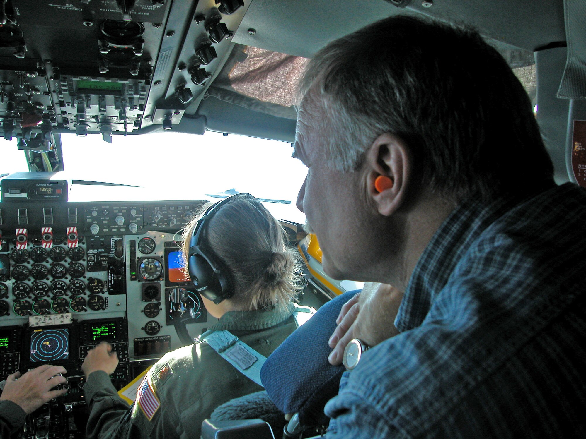 BEALE AIR FORCE BASE, Calif. --  An employer observes flight operations in a cockpit of a KC-135 assigned to the 940th Air Refueling Wing during a refueling mission  with A-10 Warthog?s from the 124th Wing from the Idaho Air National Guard. The refueling mission was part of the 940th ARW bosses flight orientation where employers got to view a refueling mission and learn about the mission of the 940th ARW. (U.S. Air Force Photo/ Staff Sgt. Luke Johnson)