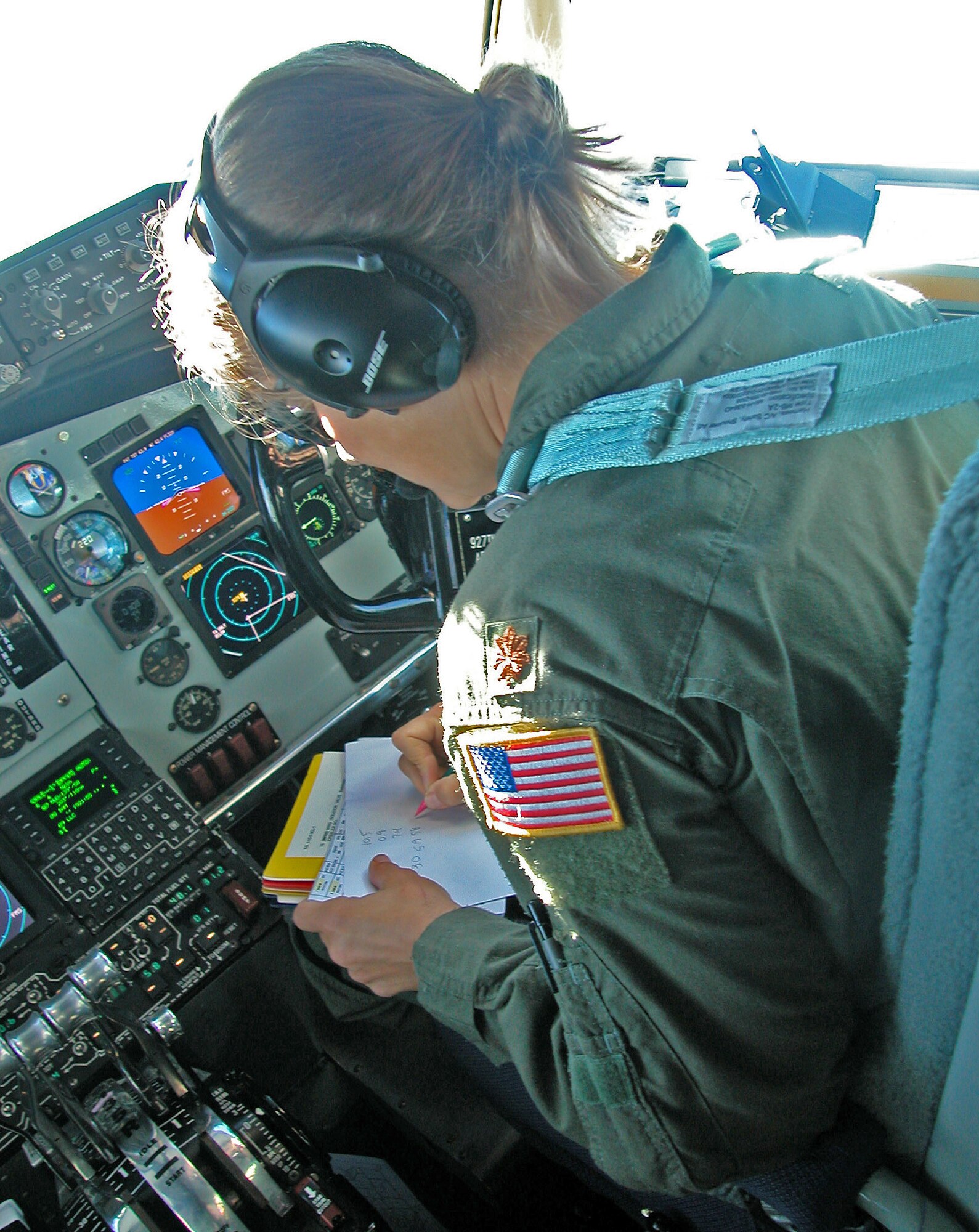 Air Force Maj. Jennifer Fogle, a pilot with the 940th Air Refueling Wing takes notes during a refueling mission with A-10 Warthog?s from the 124th Wing from the Idaho Air National Guard. The refueling mission was part of the 940th ARW bosses flight where employers got to see the professionalism of Air Force reservists from the 940th ARW. The bosses? flight was set up in appreciation for the support employers provide to traditional reservists in the wing. (U.S. Air Force Photo/ Staff Sgt. Luke Johnson)          