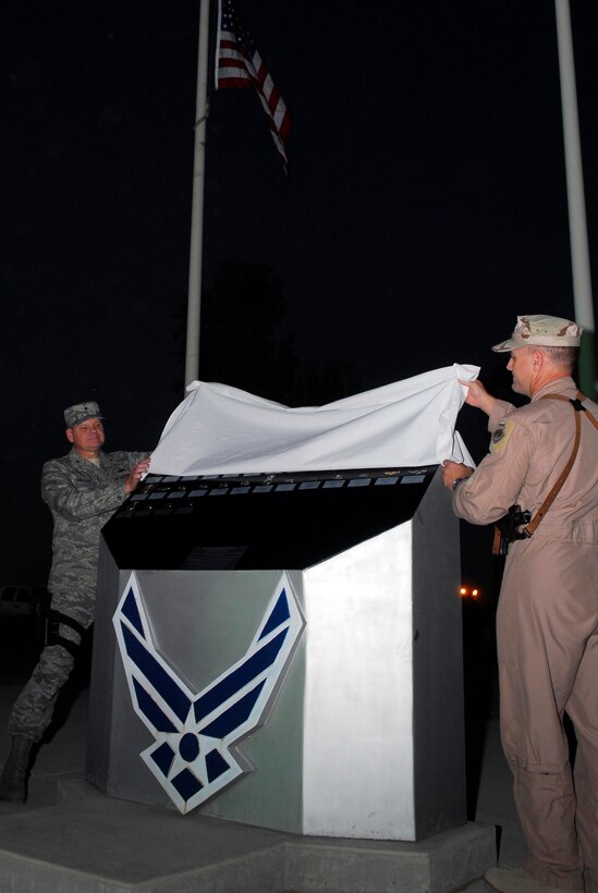 BALAD AIR BASE, Iraq -- Brig. Gen. Dana Simmons, Air Force Office of Special Investigations commander, and Brig. Gen. Burt Field, 332nd Air Expeditionary Wing commander, unveil the names of the three special agents added to the Fallen Airman Memorial here, Nov. 4. Special Agents Thomas Crowell, David Wieger and Nathan Schuldheiss of AFOSI Expeditionary Detachment 2411 paid the ultimate sacrifice Nov. 1. Their names join the other 40 Airmen listed on the memorial who died serving in Iraq. (U.S. Air Force photo/Staff Sgt. Joshua Garcia)