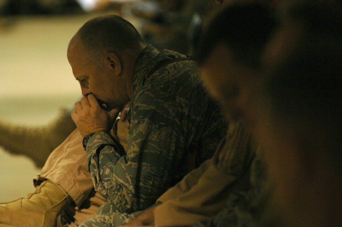 BALAD AIR BASE, Iraq -- Col. Karl Bosworth, 732nd Air Expeditionary Group commander, reflects on the sacrifice of three fallen Airmen during a memorial service here, Nov. 4. More than 300 Airmen and Soldiers paid their final respects to Special Agents Thomas Crowell, David Wieger and Nathan Schuldheiss of Air Force Office of Special Investigations Expeditionary Detachment 2411. The three Airmen were killed Nov. 1 by and improvised explosive device. (U.S. Air Force photo/Maj. John Sheets)