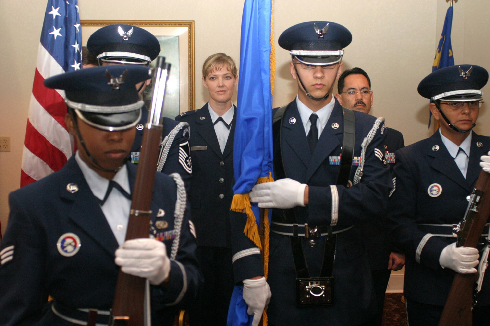 The 482nd Fighter Wing Honor Guard retires the colors during the assumption of command ceremony hosted by the 482nd FW Mission Support Squadron Nov. 3. Capt. Christy Shaw (left, rear) assumed command of the squadron. She is flanked by the squadron first sergeant, Master Sgt. Anthony Servian. Senior Airman Tara Austin is leaving the picture on the left; Senior Airman Scott Sendtko is the honor guard Airman in the center; Tech Sgt. Consuelo Santiago is on the right.
(Air Force photo/Tech. Sgt. Paul Dean)
