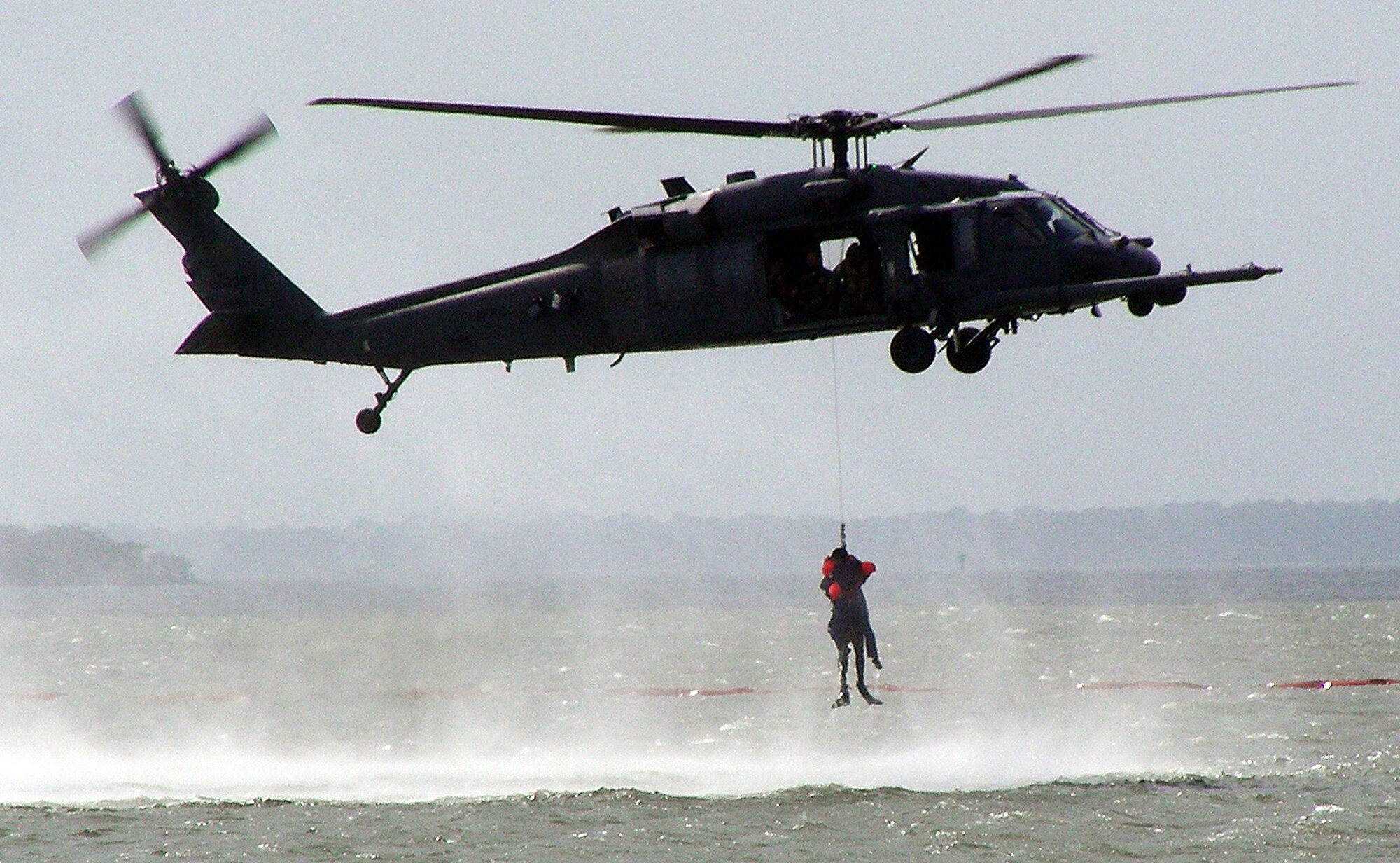 Air Force Reserve pararescuemen and aircrews from the 920th Rescue Wing kicked off NASA's World Space Expo Air Show with a search-and-rescue demonstration. John Zarrella, CNN News Correspondent, acted as a downed astronaut during the demonstration, which simulated a Mode 8 emergency Space Shuttle open-water bailout Nov 2. Pararescuemen and crews from the 920RQW support every space shuttle launch as part of a joint task force in case an emergency occurs. (U.S. Air Force photo/Capt. Cathleen Snow) 
