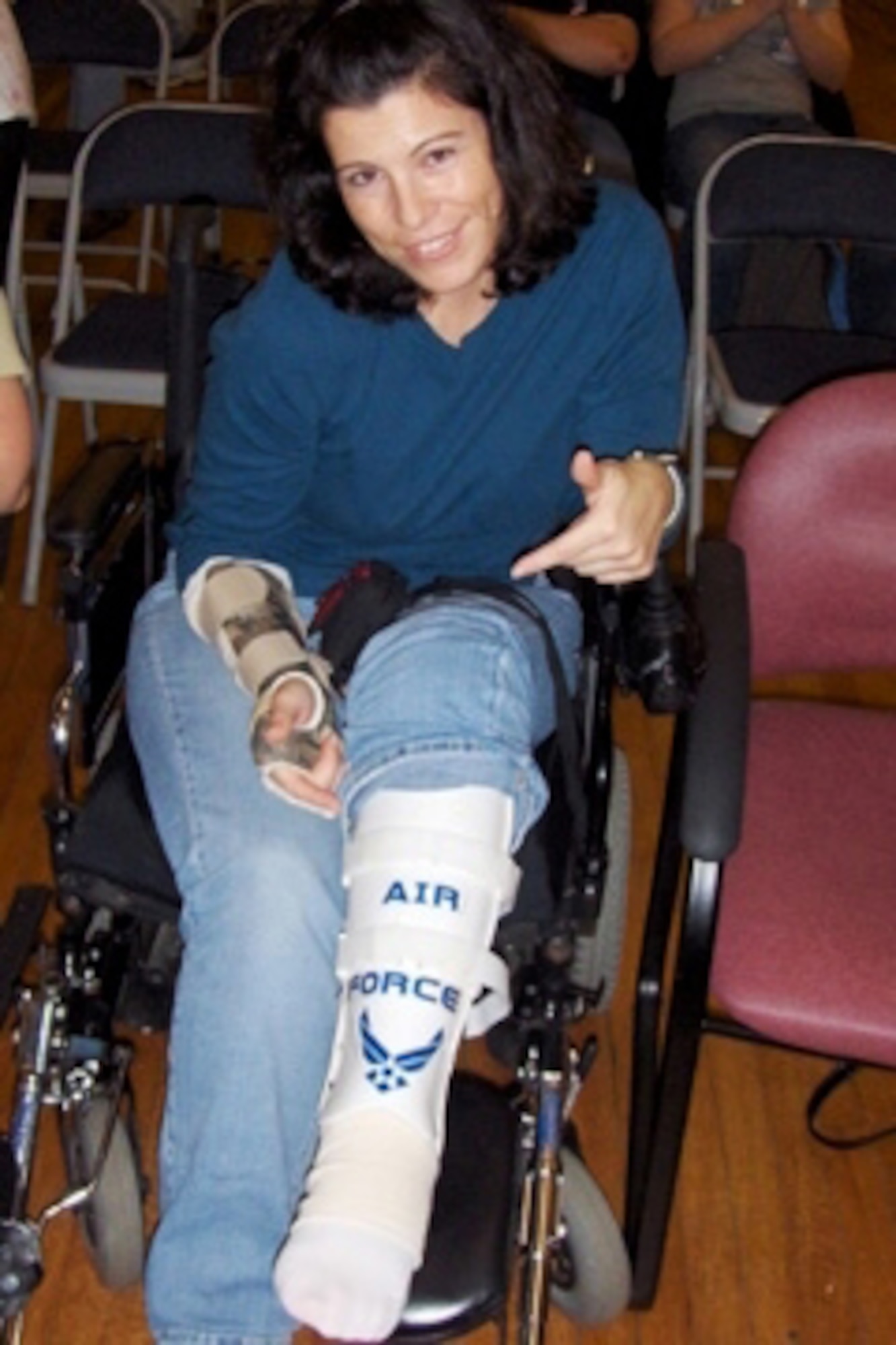 Senior Airman Diane Lopes, a reservist with the 920th Rescue Wing at Patrick Air Force Base, Fla., displays her Air Force pride while rehabilitating from a rocket attack. The security forces specialist was wounded Sept. 21 at Kirkuk Air Base, Iraq just four weeks after being deployed there. The cast on her left leg protects the broken tibia and fibula beneath, a result of shrapnel from the blast. She said she put the Air Force logo on her cast because of the many Soldiers and Marines there with her at Walter Reed. "I had to represent," she said. (Courtesy photo)