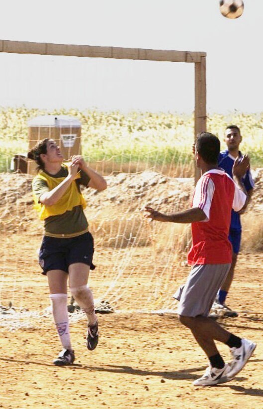 Second Lt. Haley Katz (left) plays soccer in Fallujah, Iraq, Nov. 4, 2007, during her deployment in support of Operation Iraqi Freedom. Katz is one of four Marines chosen to tryout for the U.S. Armed Forces soccer team May 9-26 at Pope Air Force Base, N.C. If chosen for the team, she will compete in the Netherlands at the Conseil International du Sport Militaire games.