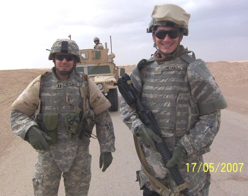 Maj. Paul Nichols, 961st Airborne Air Control Squadron, poses for a photo with a fellow service member. (Courtesy photo)