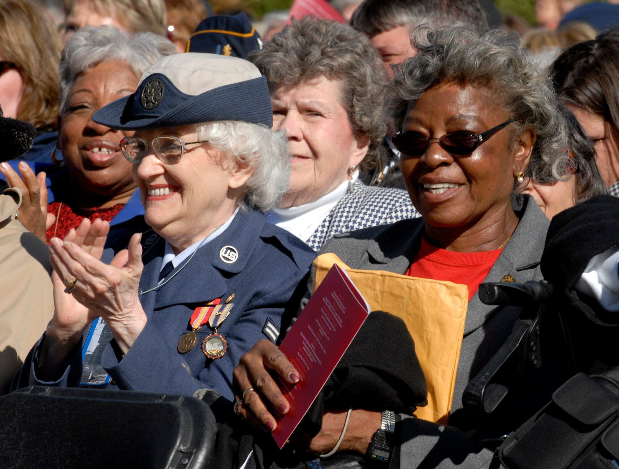 Women veterans applaud Secretary of Defense Robert M. Gates as he delivers the keynote address Nov. 3 during the ceremony celebrating the 10th anniversary of the Women in Military Service for America Memorial at Arlington National Cemetery. (DOD photo/Cherie A. Thurlby)