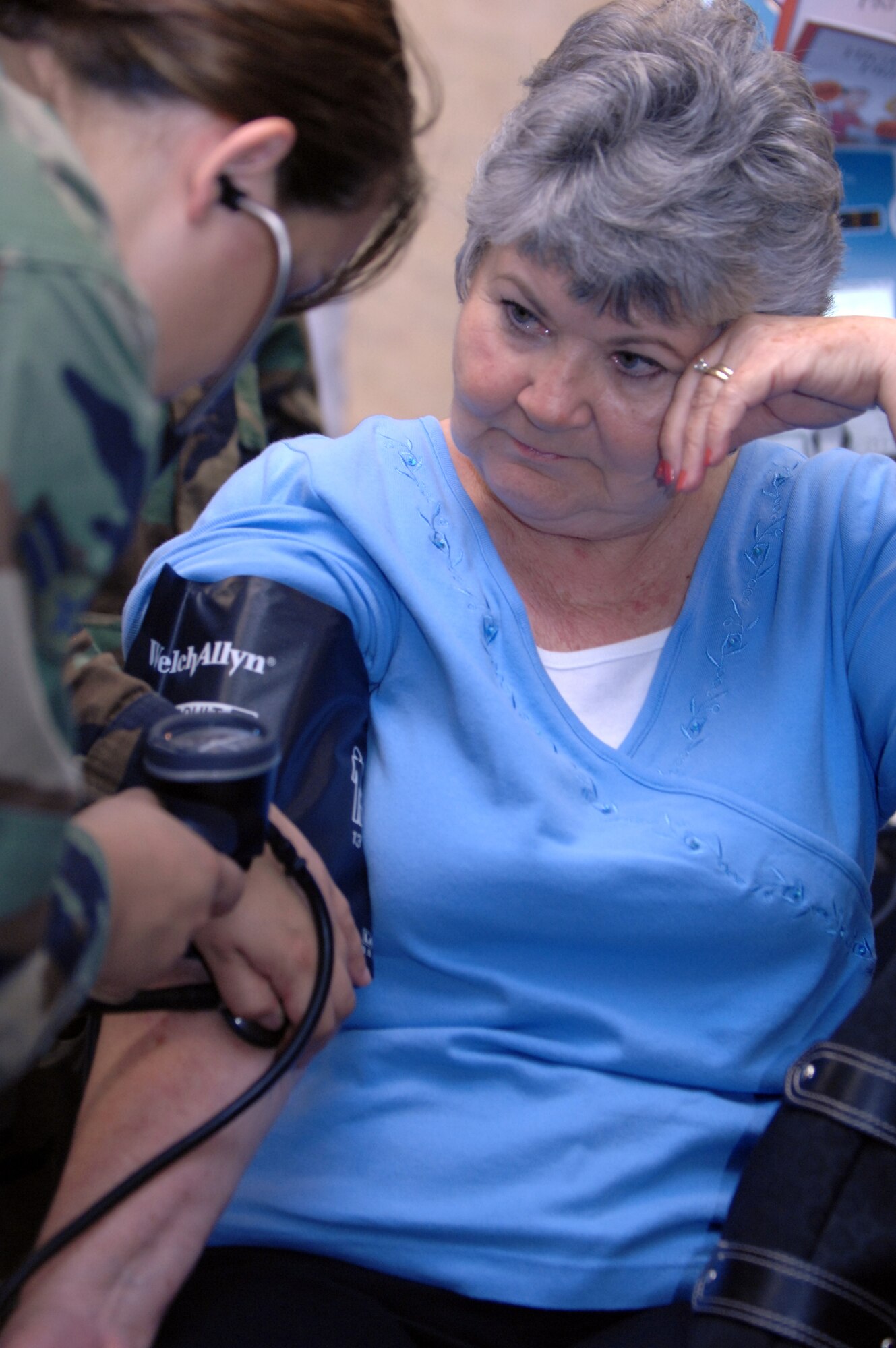 Linda Hunter, spouse of retired seamen David Hunter, has her blood pressure taken by Airman 1st Class Monica Gonzalez, 23rd Medical Group, at the Retiree Appreciation Ceremony at Moody Air Force Base, Ga., Nov. 3.  Retiree Appreciation Day was the conclusion of a week-long celebration for retiree's. (U.S. Air Force photo by Senior Airman Elizabeth Rissmiller)
