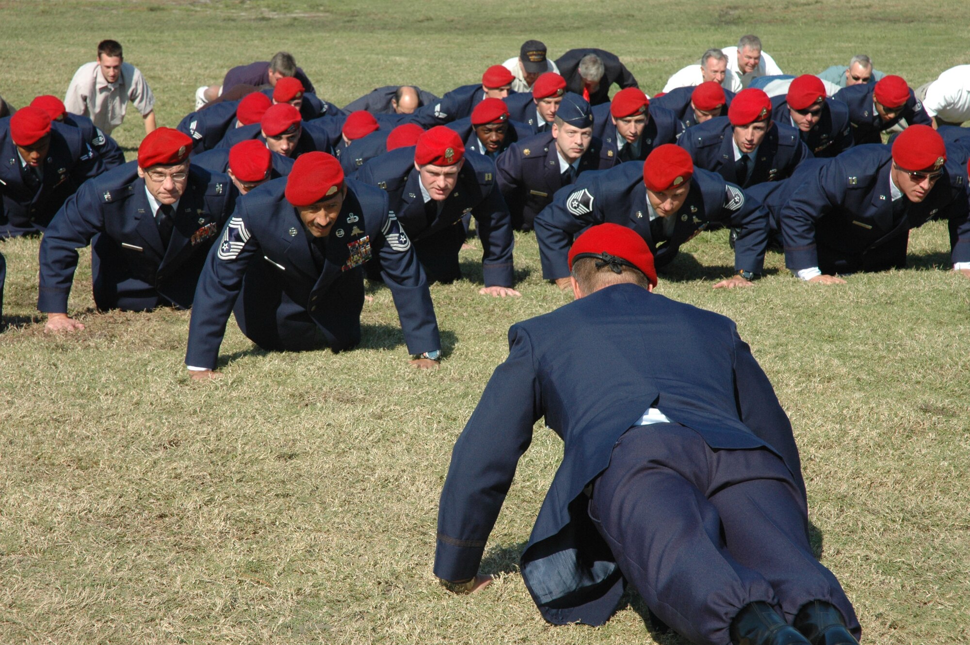 HURLBURT FIELD, Fla. -- Col. Marc Stratton, 720th Special Tactics Group commander, leads a flight of current and retired combat controllers in memorial push-ups here Nov. 3 during the Annual Combat Control Association reunion and memorial service.  More than 100 people gathered for the ceremony to honor their fallen comrades. (U.S. Air Force photo by Dawn Hart)
