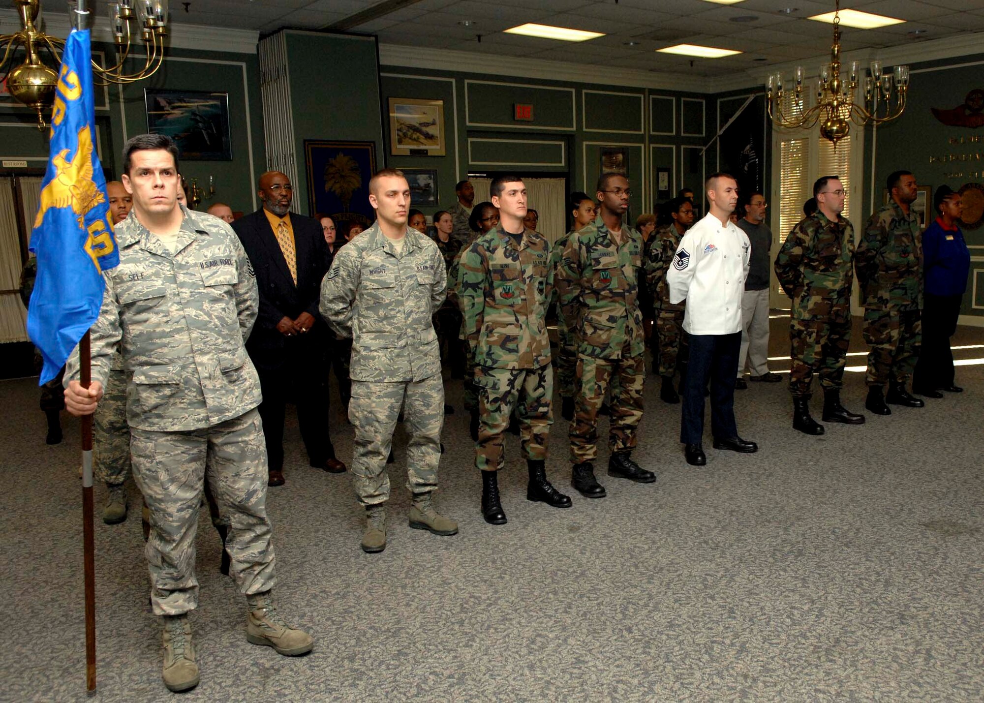 SHAW AIR FORCE BASE, S.C.-- Master Sgt. Fred Self, 20th Mission Support Squadron first sergeant, acts as guidon during the activation of the 20th Force Support Squadron Nov. 5. The 20th Services Squadron and the 20th MSS have been deactivated and combined to form the 20th Force Support Squadron (Provisional). (U.S. Air Force photo/Staff Sgt. Henry Hoegen Jr.)